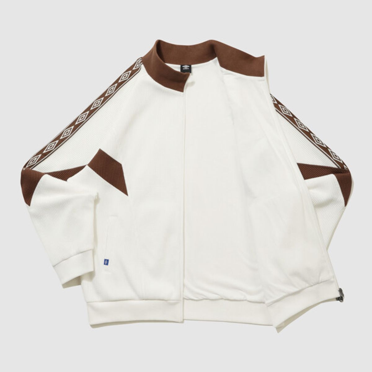 엄브로(UMBRO) 컬러블럭 와플 트랙 자켓 아이보리 UR124CFT11