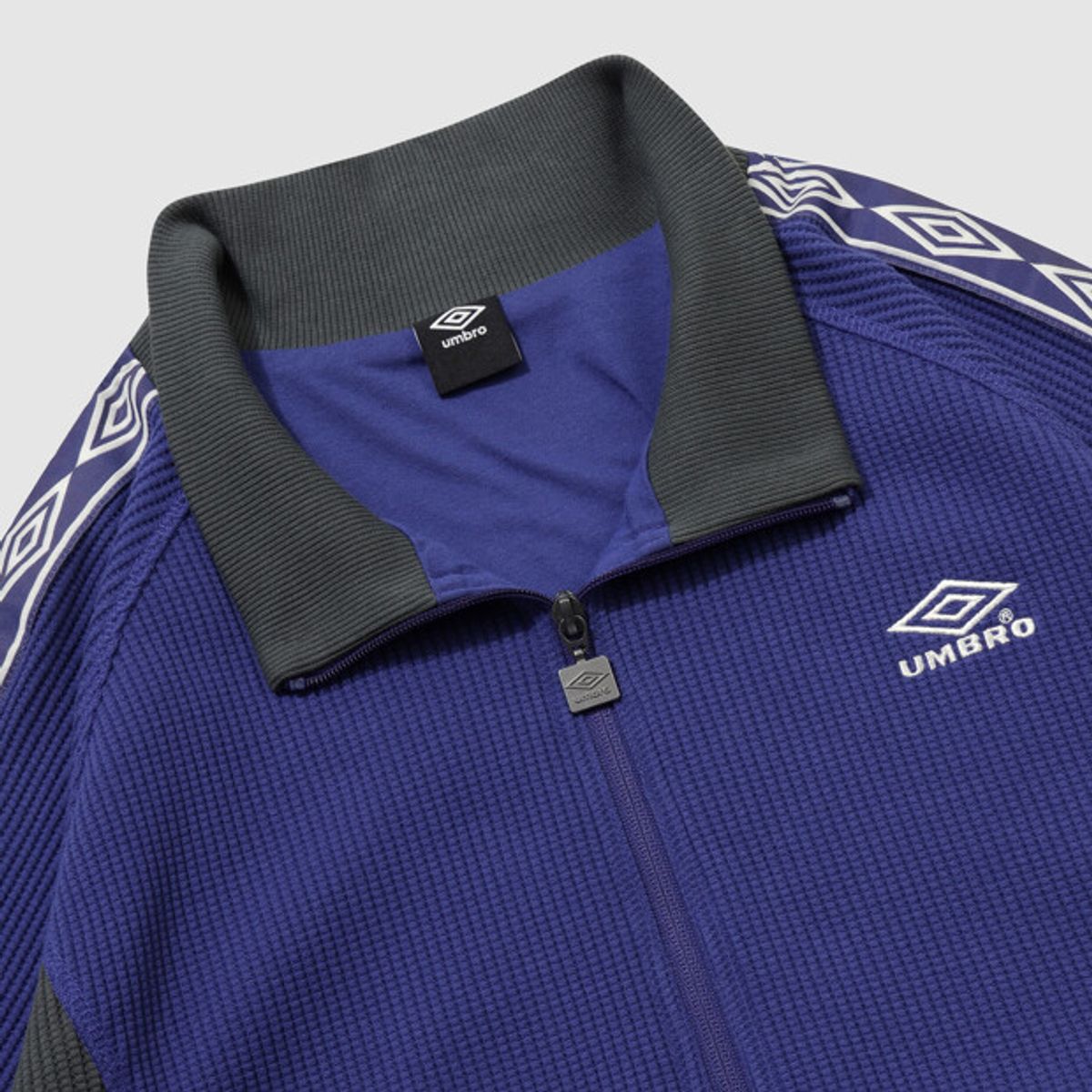 엄브로(UMBRO) 컬러블럭 와플 트랙 자켓 블루 UR124CFT11