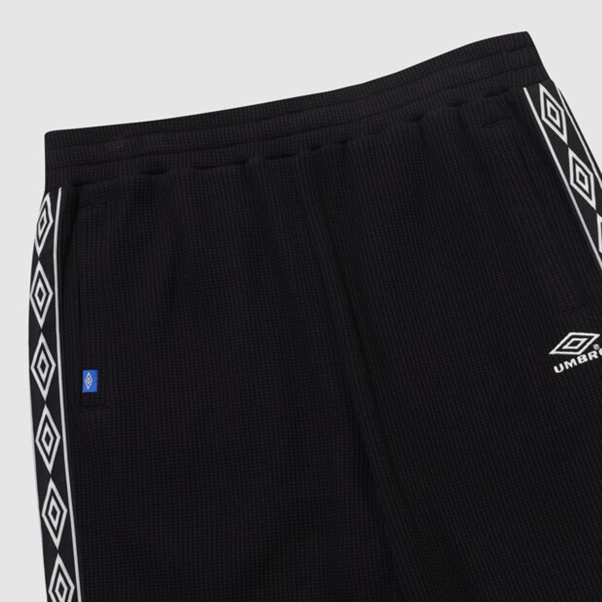 엄브로(UMBRO) 와플 와이드 조거 2WAY 트랙 팬츠 블랙 UR123CFP11