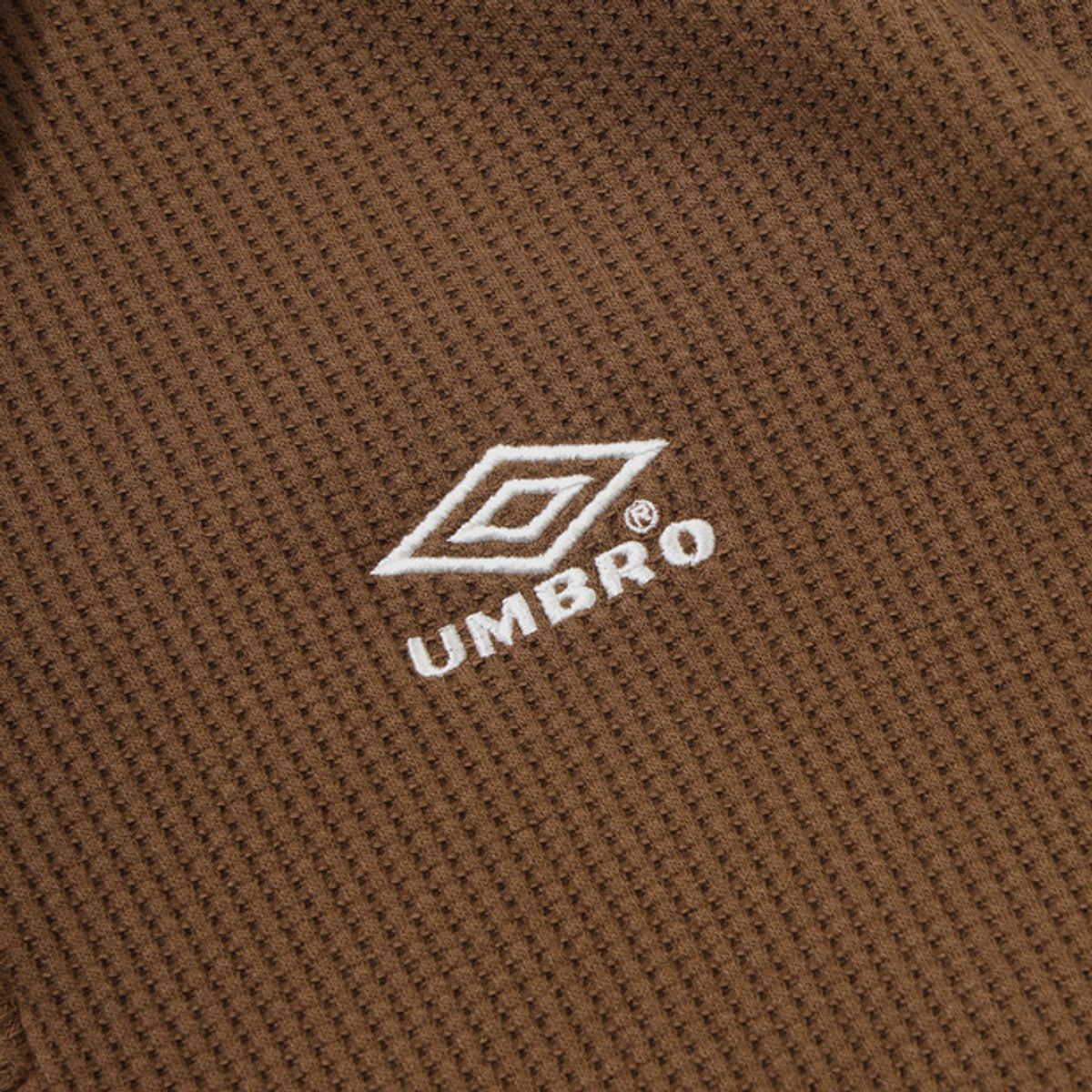 엄브로(UMBRO) 와플 우먼스 트랙 하프집업 브라운 UR122CFS11