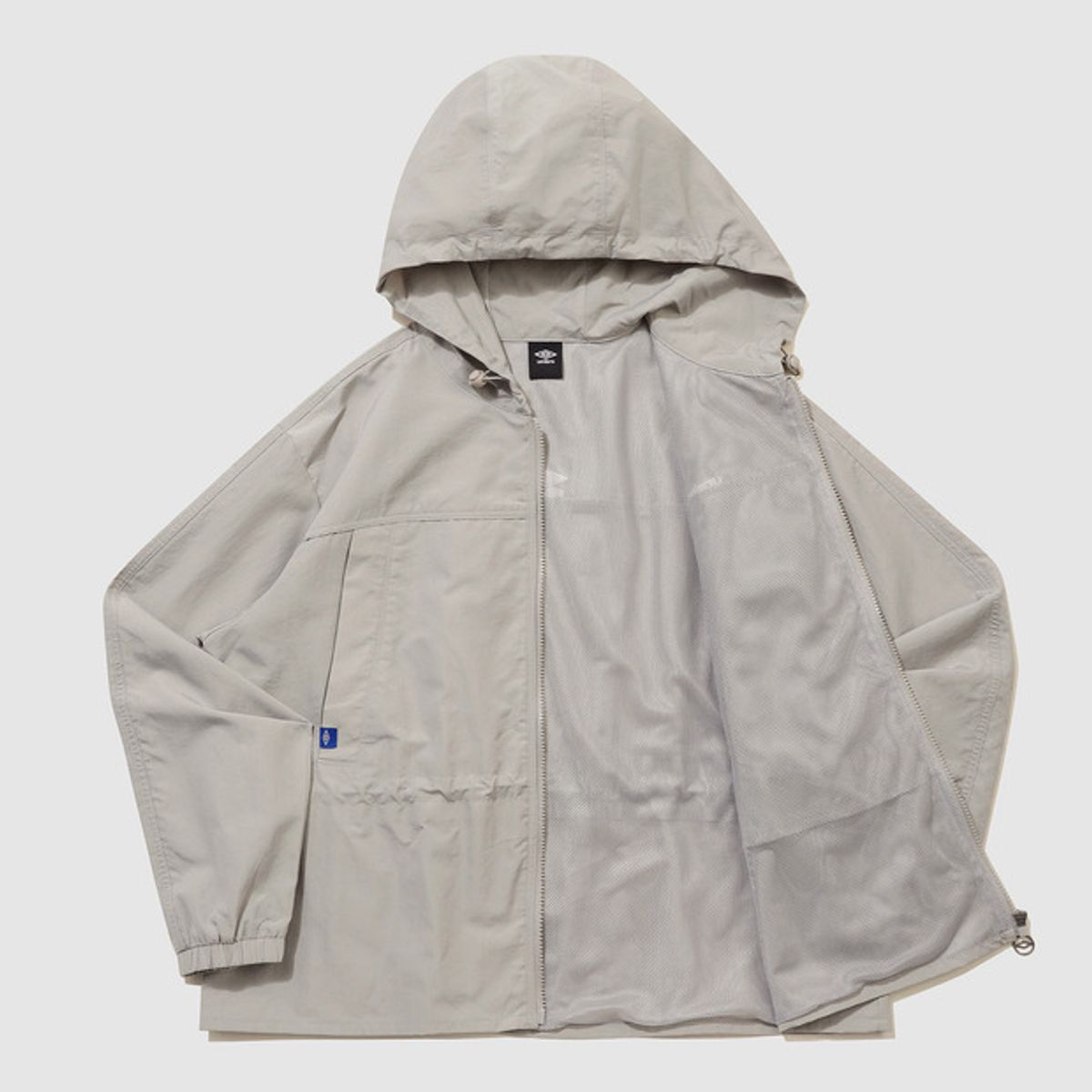엄브로(UMBRO) 우먼스 트랙 후드 바람막이 자켓 베이지 UR122CJK12