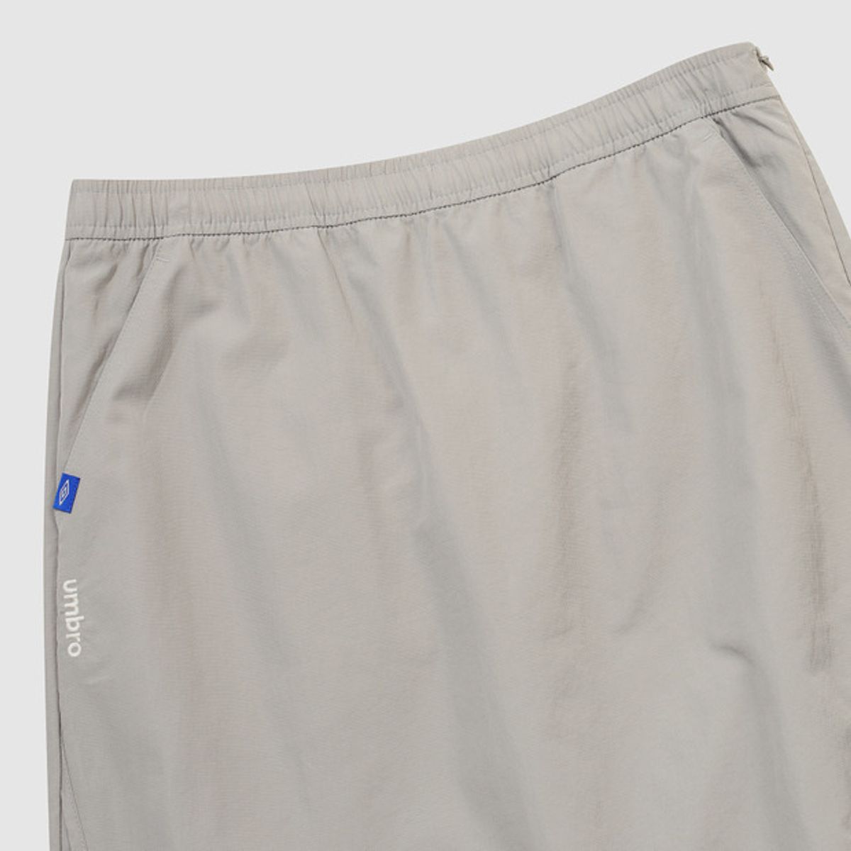 엄브로(UMBRO) 우먼스 트랙 우븐 롱스커트 베이지 UR122CSK11