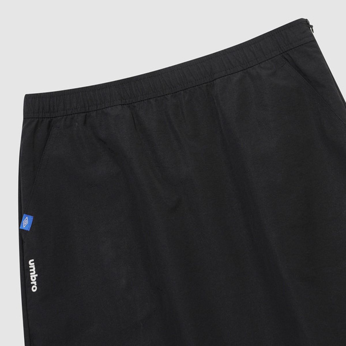 엄브로(UMBRO) 우먼스 트랙 우븐 롱스커트 블랙 UR122CSK11