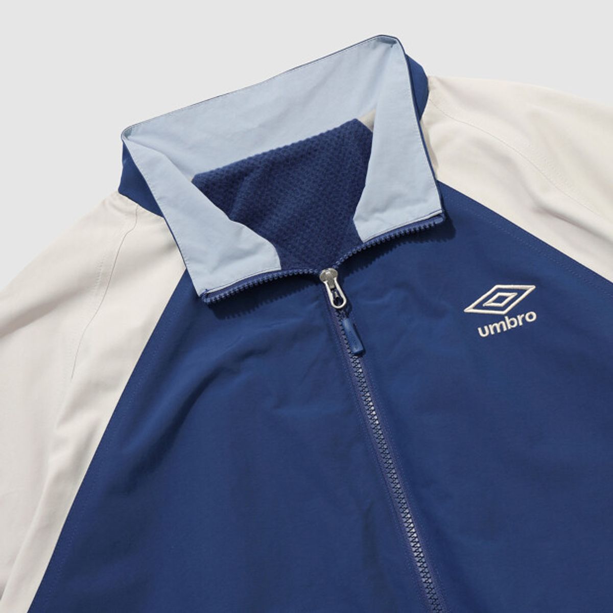 엄브로(UMBRO) 팝러쉬 기모 바람막이 자켓 블루 UR123CJK14