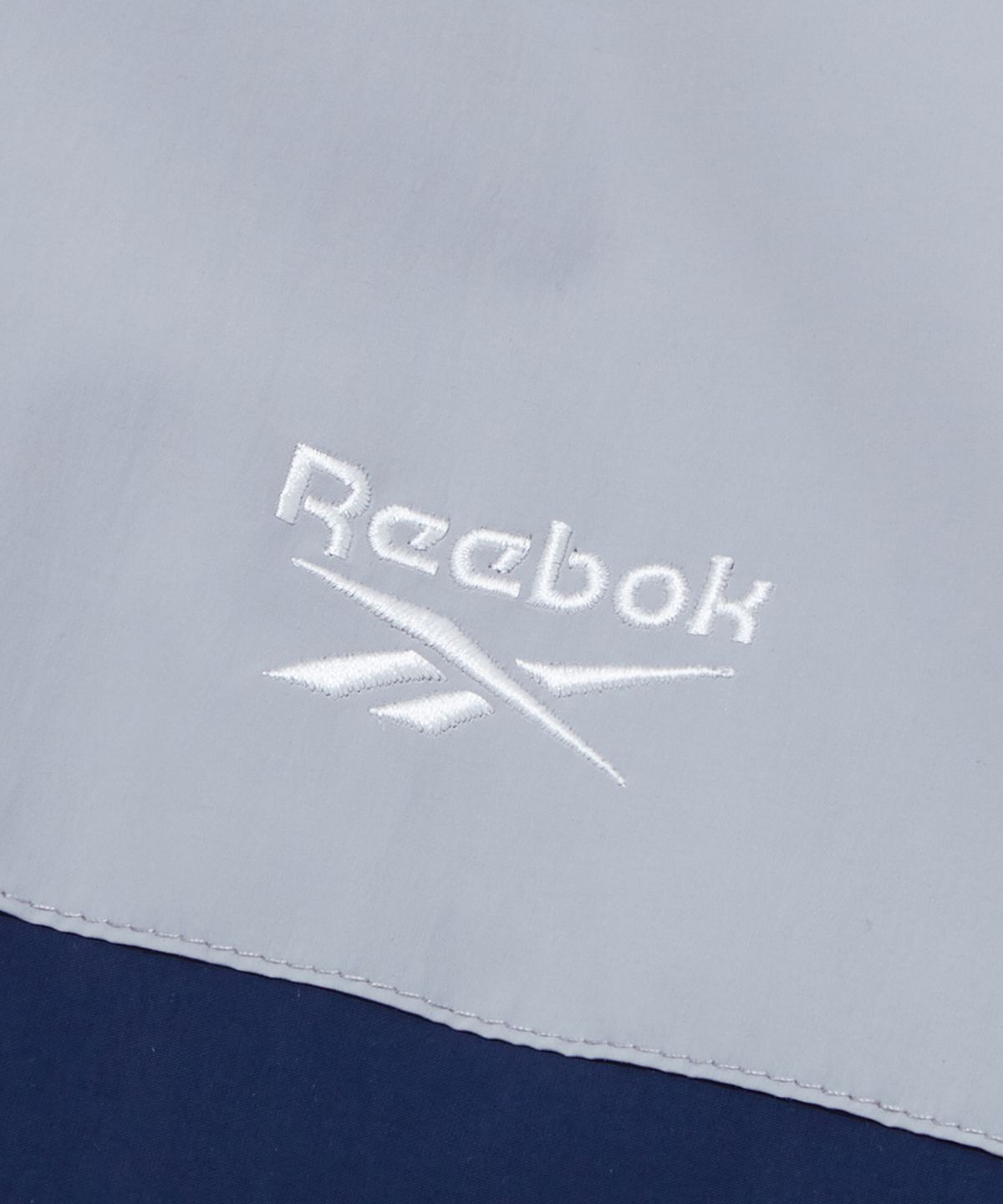 리복(REEBOK) 스포티 컬러블럭 패딩 자켓 - 라이트 그레이