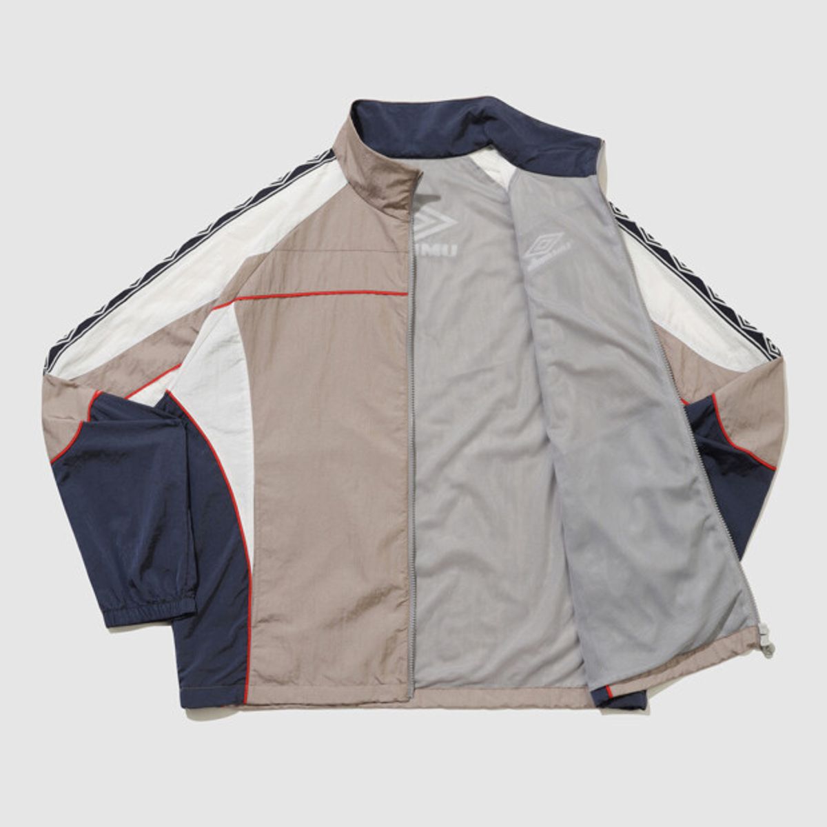 엄브로(UMBRO) HBL OG 스탠넥 바람막이 자켓 베이지 UR121CJK23
