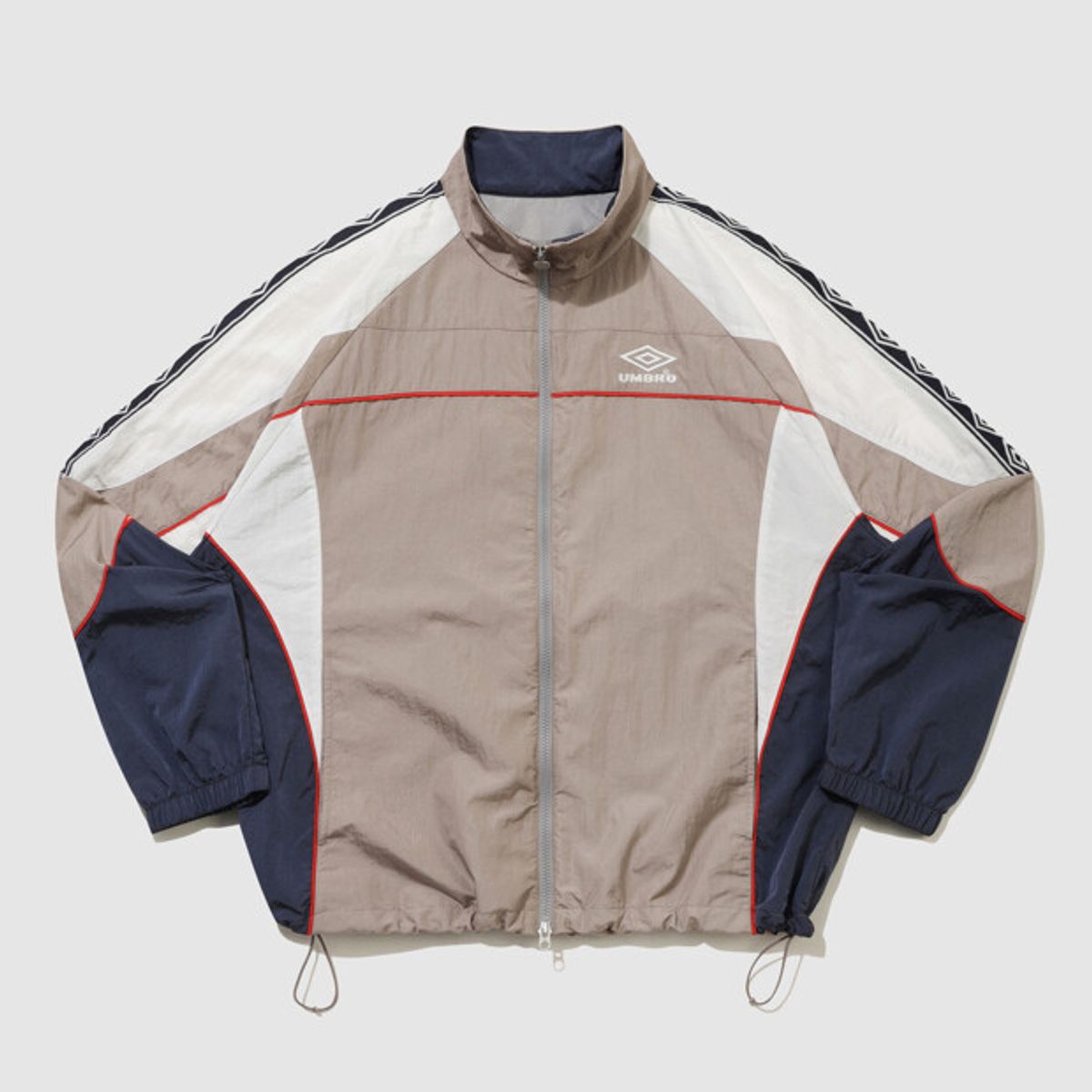 엄브로(UMBRO) HBL OG 스탠넥 바람막이 자켓 베이지 UR121CJK23