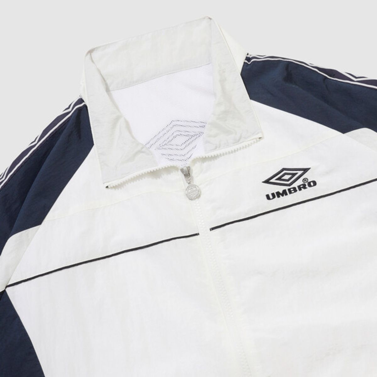 엄브로(UMBRO) HBL OG 스탠넥 바람막이 자켓 아이보리 UR121CJK23
