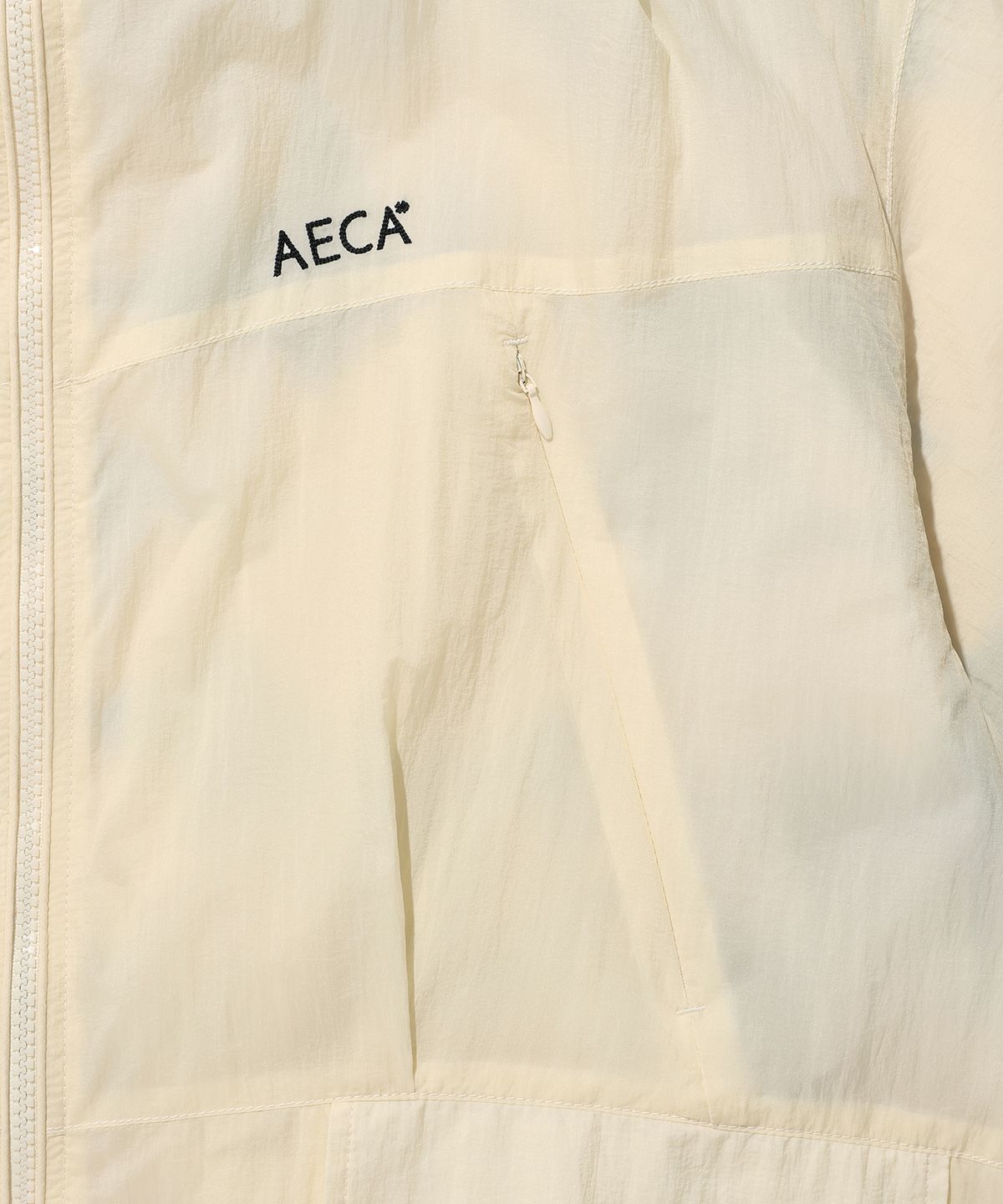 에이카화이트(AECA) REVERSIBLE PANEL WINDBREAKER-IVORY