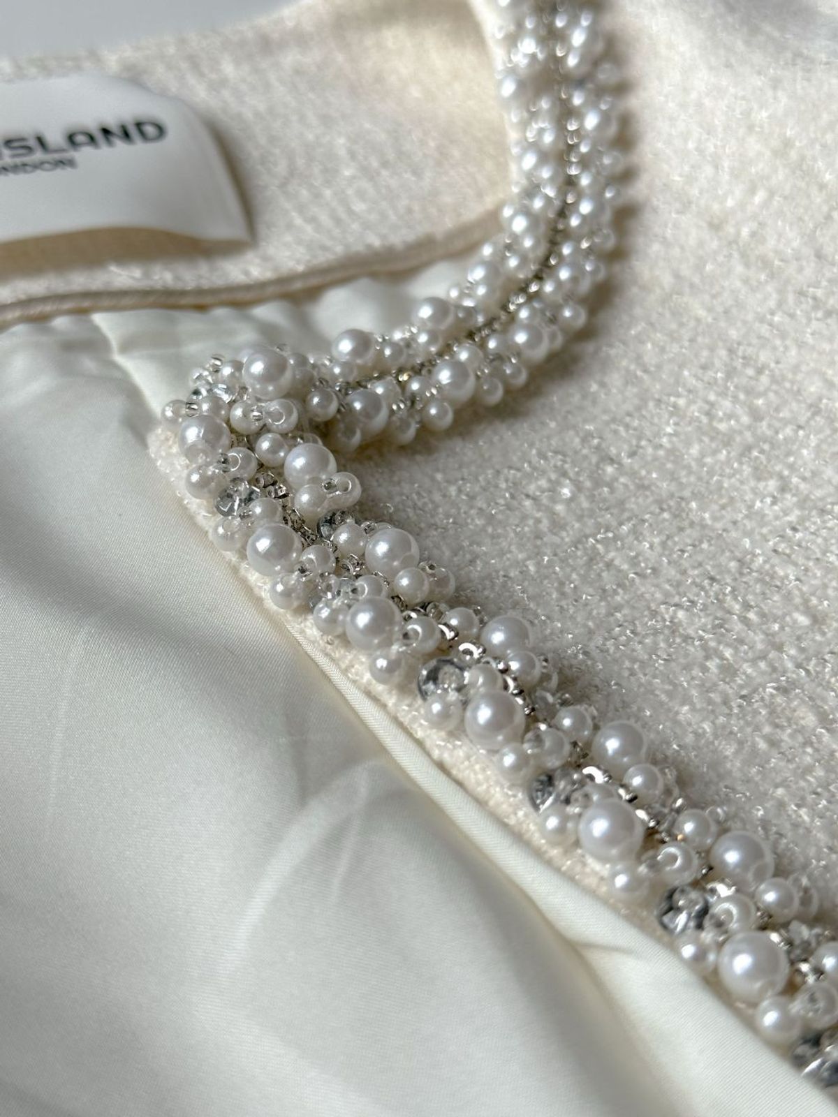 엘시 아일랜드(ELCY ISLAND) Amélie Pearl-Trimmed Tweed Jacket (IVORY)