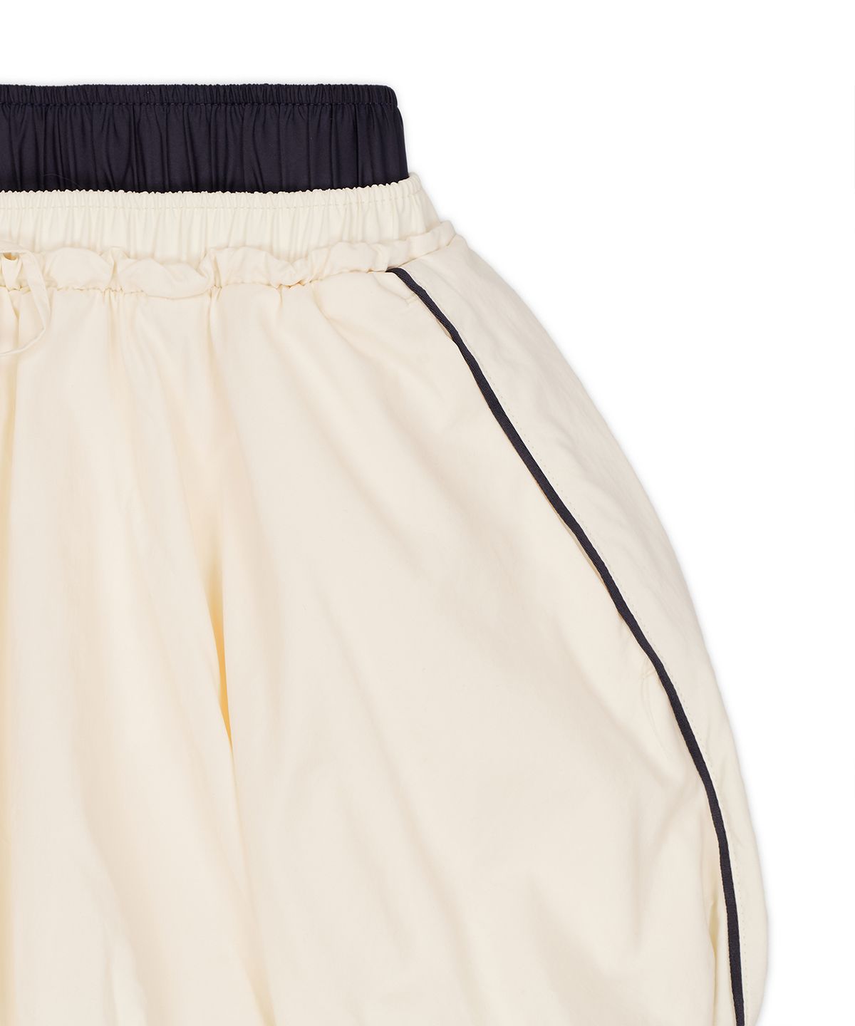 푸마(PUMA) 푸마 X 무신사 T7 벌룬 미니 스커트 - 아몬드 / 638018-87