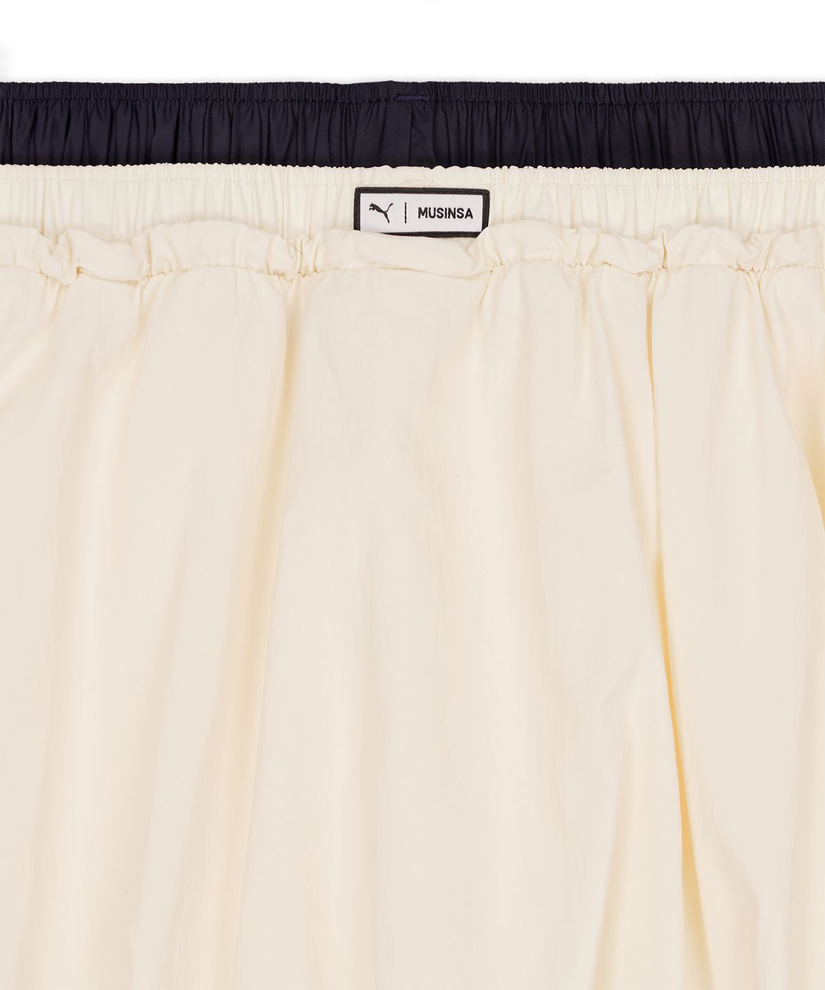 푸마(PUMA) 푸마 X 무신사 T7 벌룬 미니 스커트 - 아몬드 / 638018-87