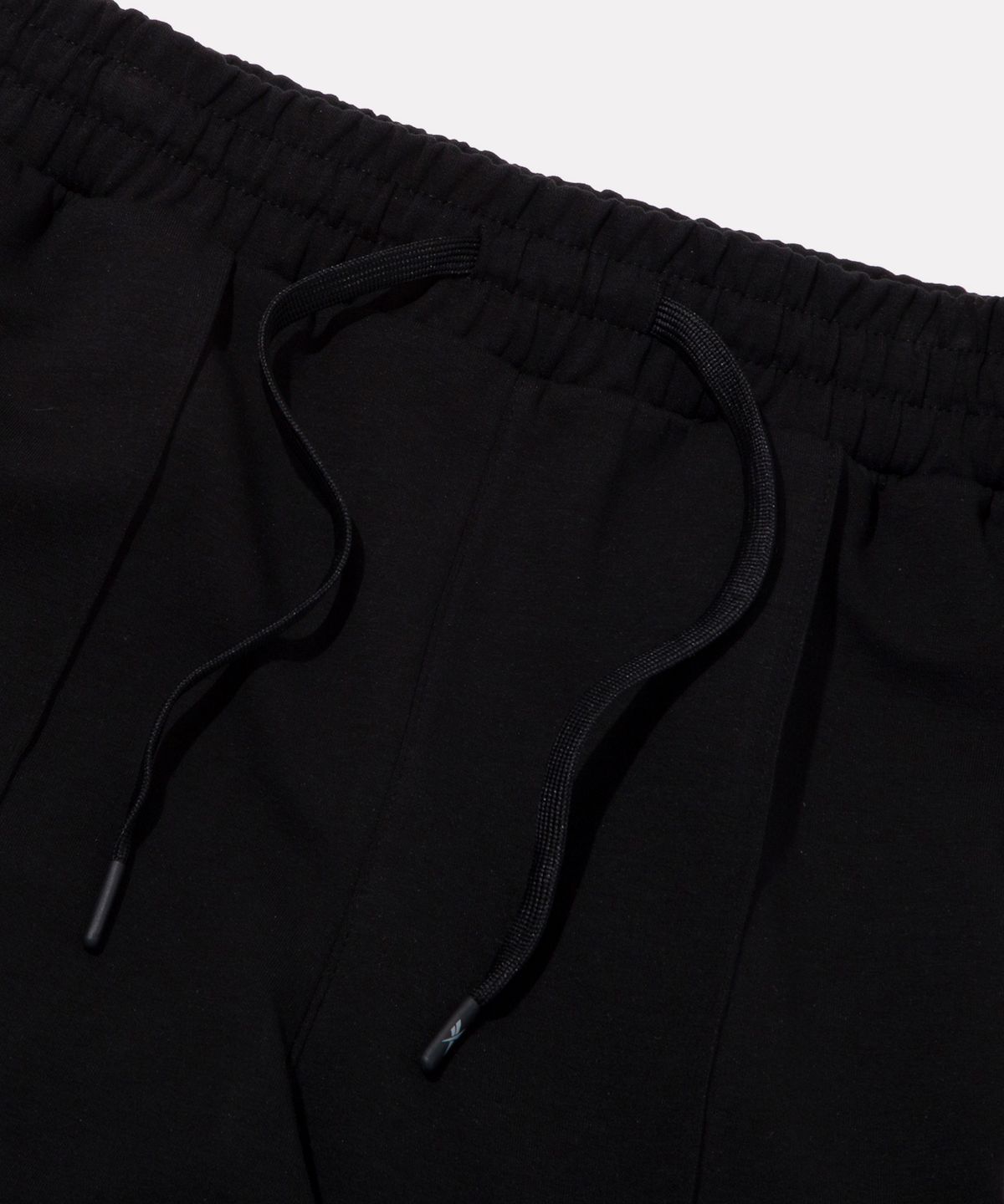 리복(REEBOK) 나노 부츠컷 트랙팬츠 (W) - 블랙