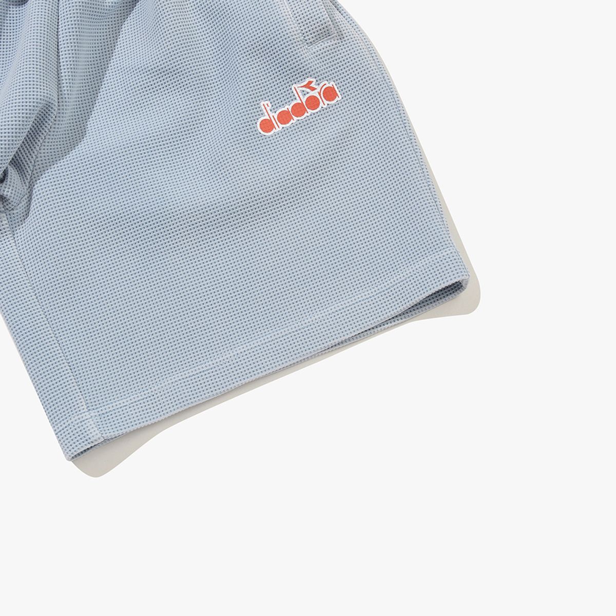 디아도라(diadora) 와플 에어로쿨 4부 워싱 쇼츠 SKY BLUE