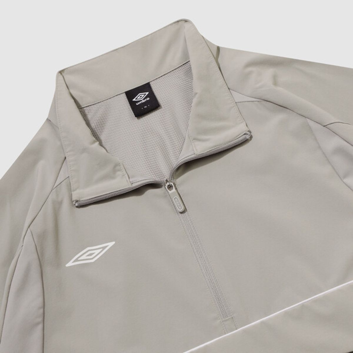 엄브로(UMBRO) 올라운드 스트레치 스탠넥 아노락 베이지 UR121SWT21