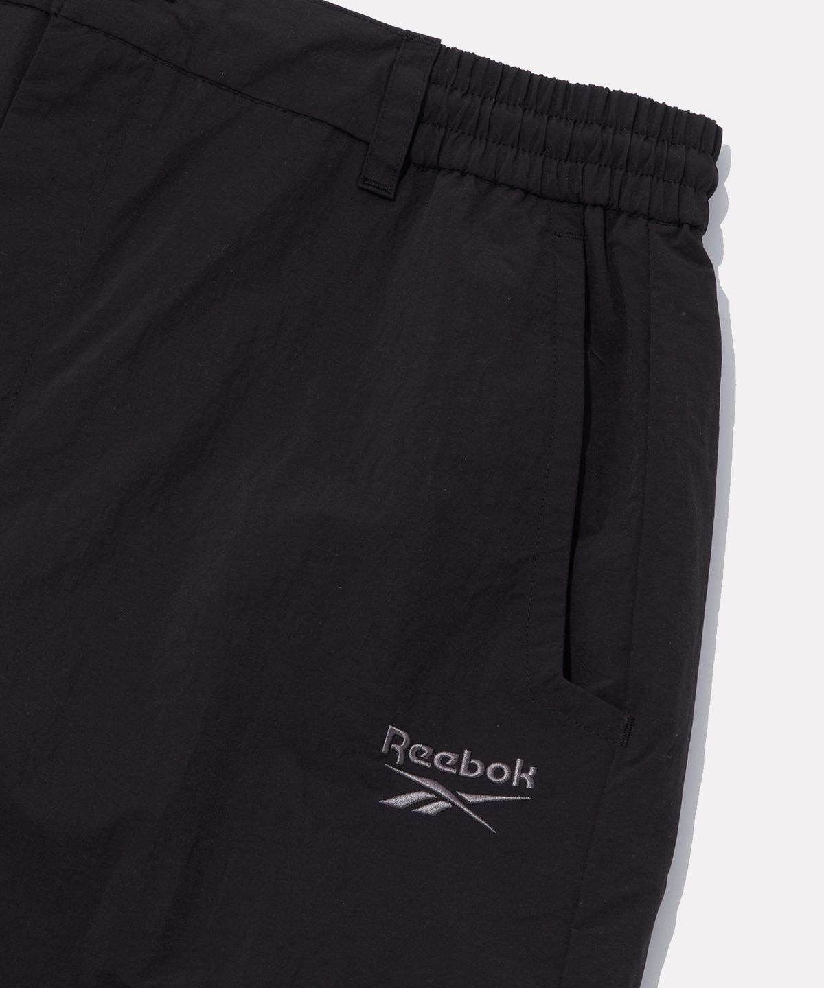 리복(REEBOK) 우븐 카고 와이드 팬츠 - 블랙