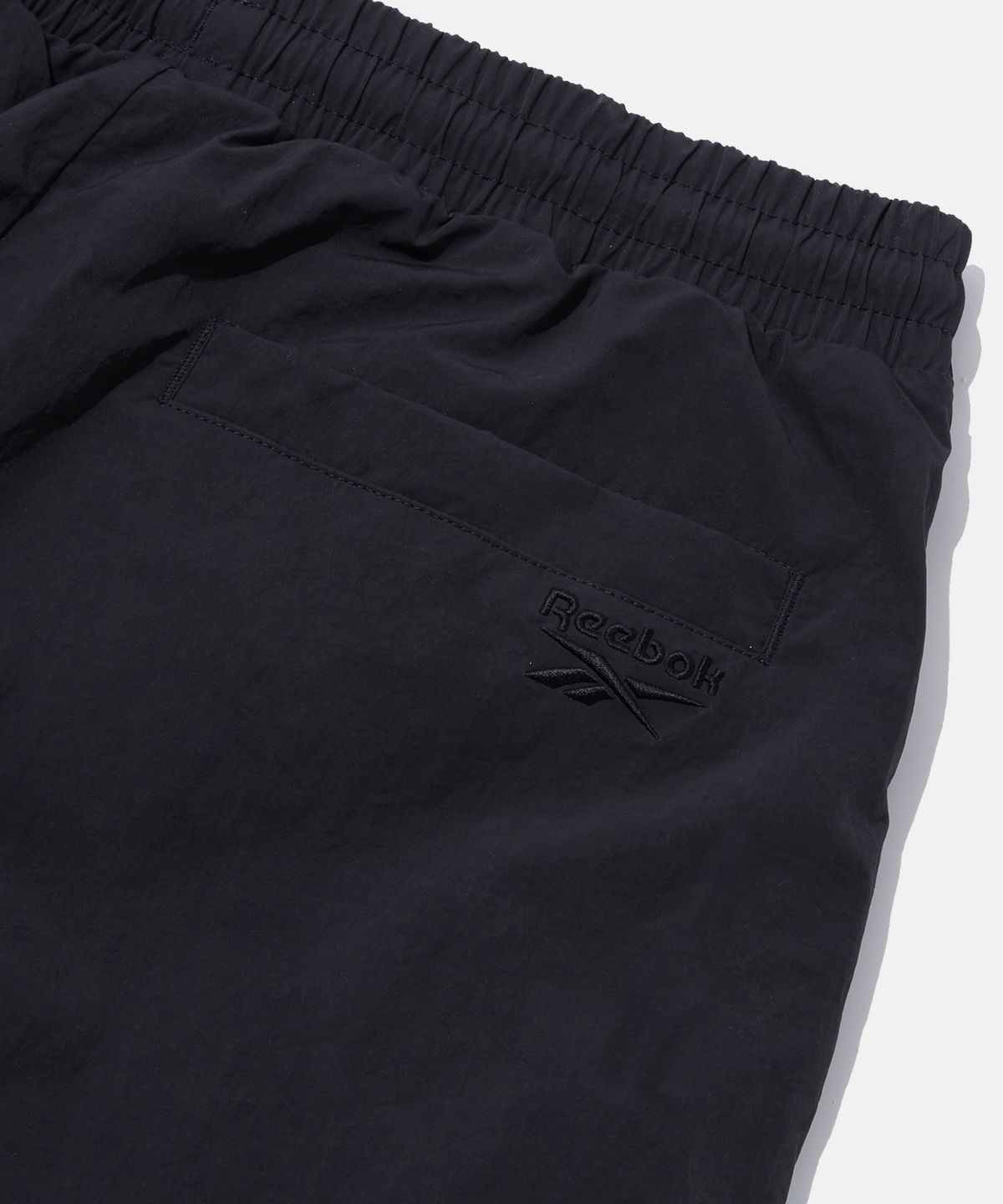 리복(REEBOK) 프리미어 우븐 트랙 팬츠 (W) - 딥 차콜