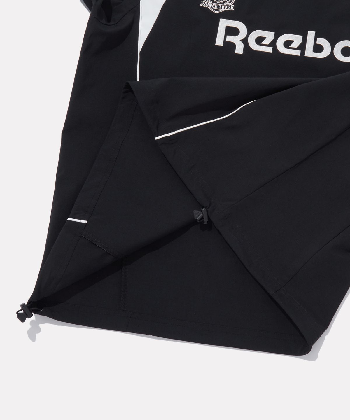 리복(REEBOK) 우븐 스트레치 트랙 피스테 - 블랙