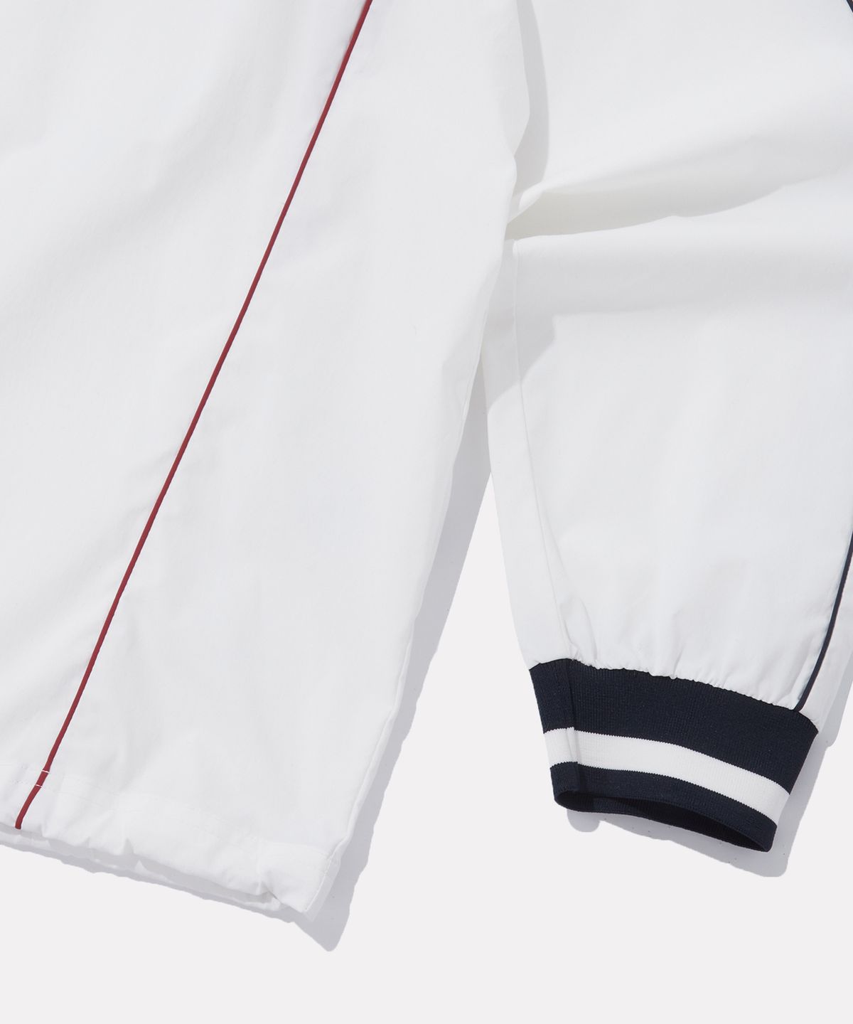 리복(REEBOK) 우븐 스트레치 트랙 피스테 - 오프 화이트