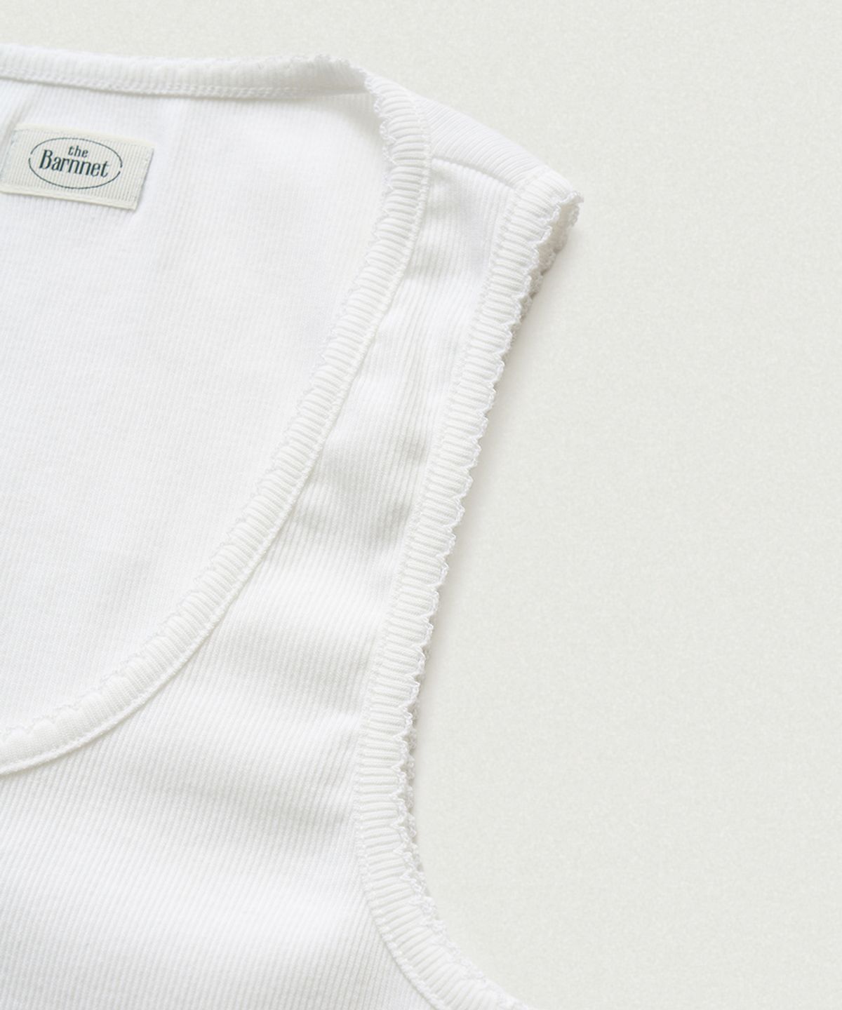 더바넷(THEBARNNET) Clara Button Layer Tank Top_Ivory