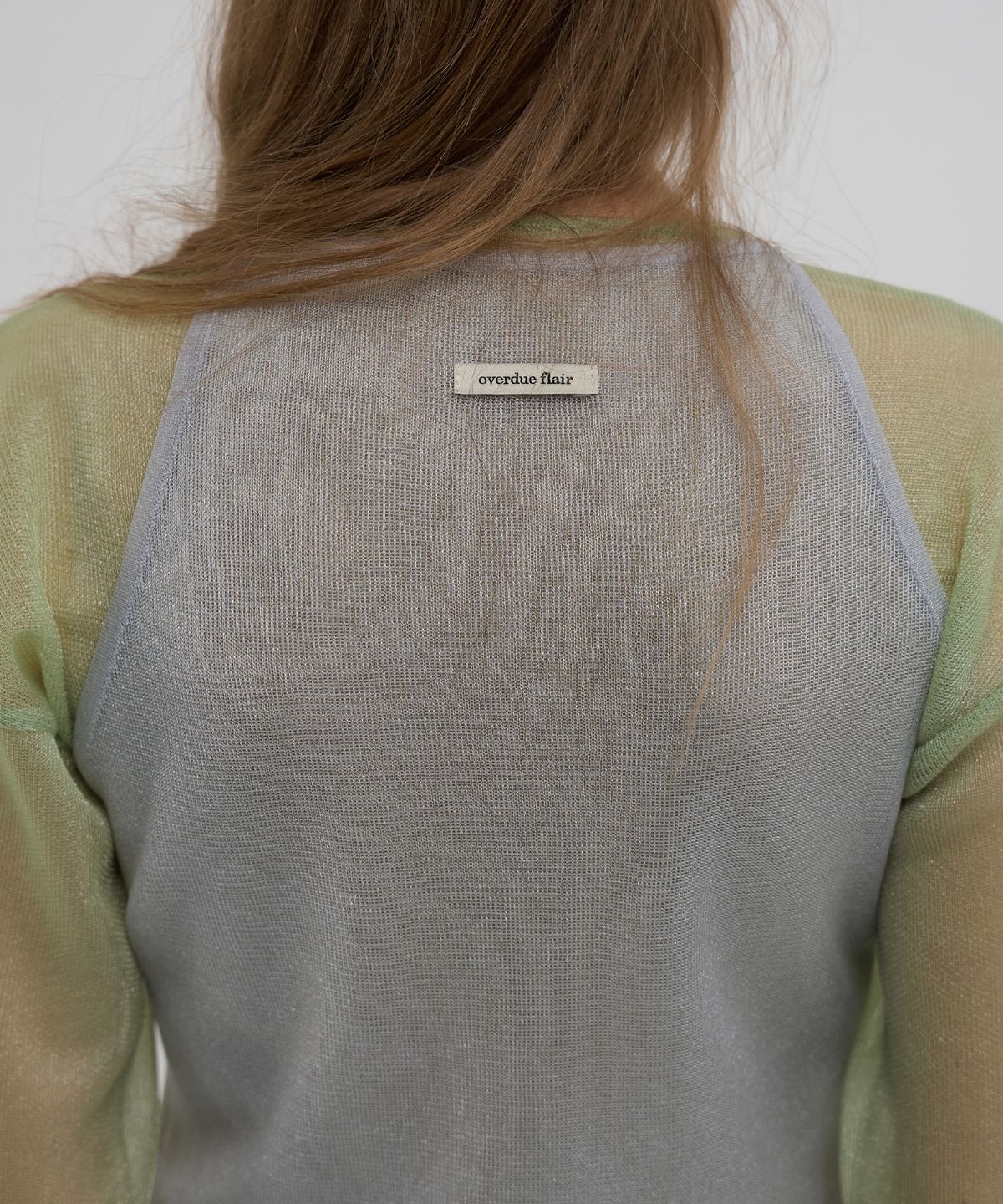 오버듀플레어(OVERDUEFLAIR) SHEER GLOSSY HALTER KNIT TOP_SILVER