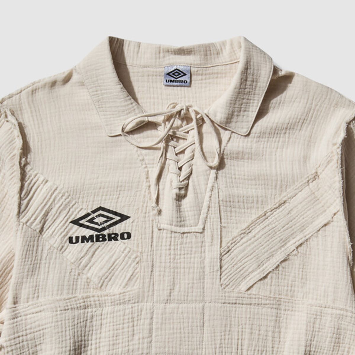 엄브로(UMBRO) [UMB X SLAM JAM] 유니어 드릴 카라 긴팔티 아이보리 UR111OTL32