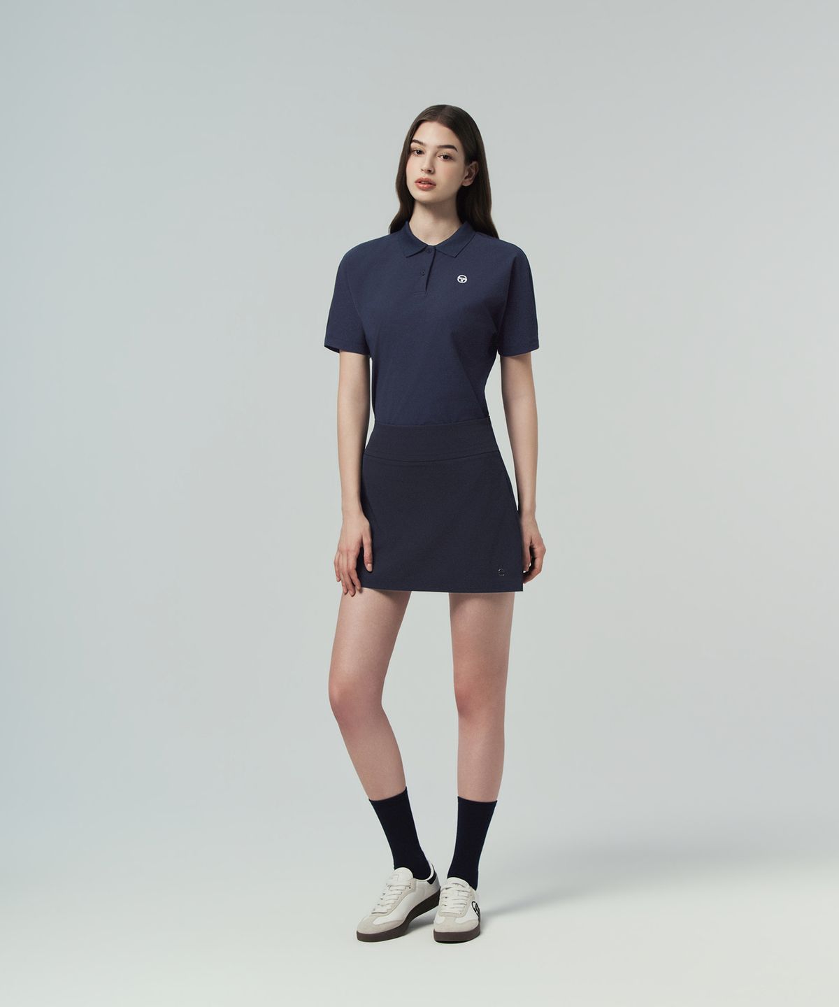 세르지오 타키니(SERGIO TACCHINI) W 타키니 플라잉 백플리츠 스커트 (Navy)