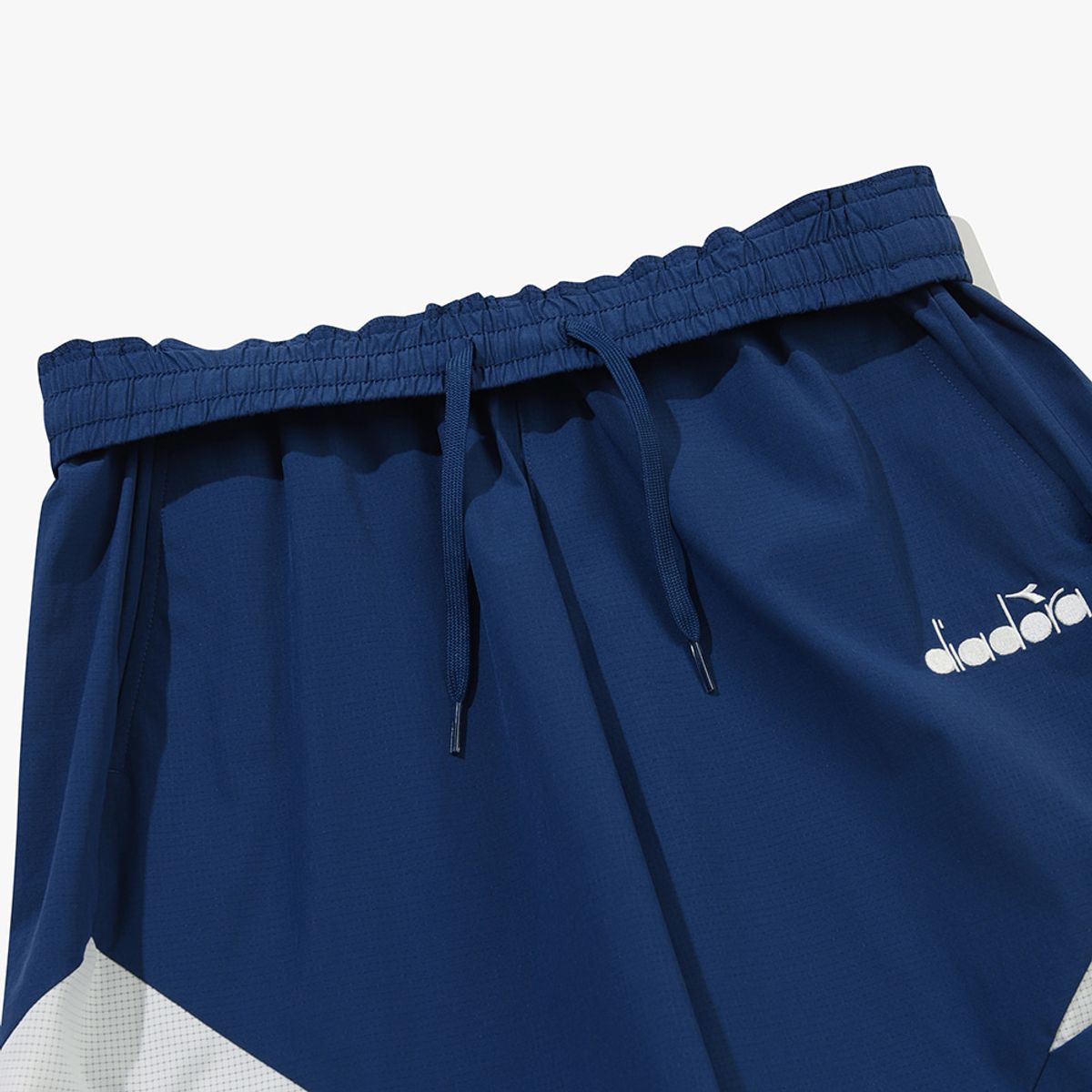 디아도라(diadora) 그랜드슬램 우븐 하프 팬츠 BLUE
