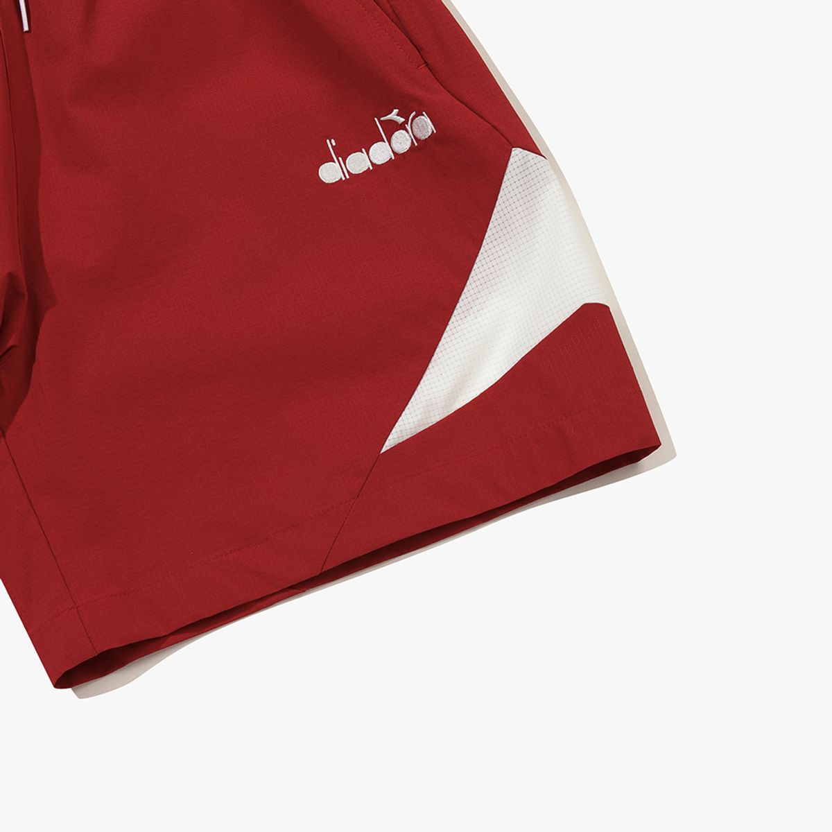 디아도라(diadora) 그랜드슬램 우븐 하프 팬츠 RED