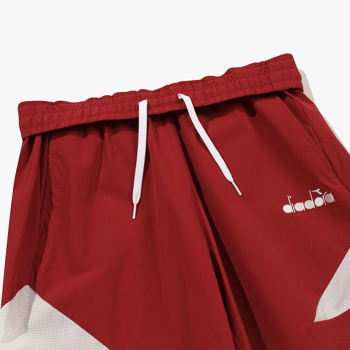 디아도라(diadora) 그랜드슬램 우븐 하프 팬츠 RED