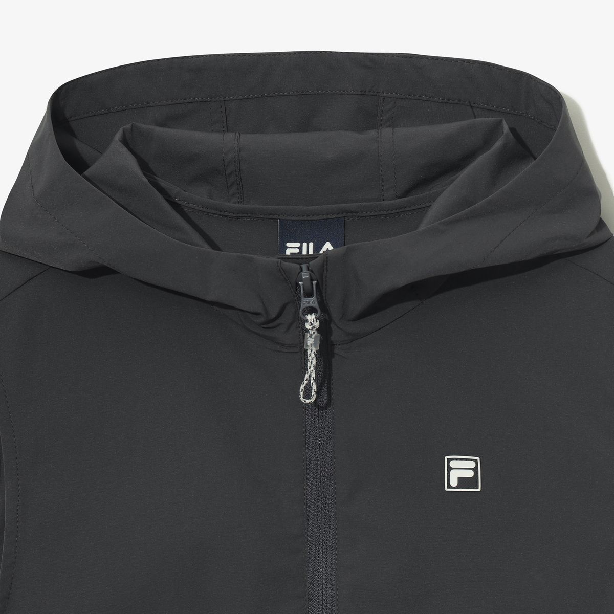 휠라 키즈(FILA KIDS) 간절기 우븐 후드 조끼