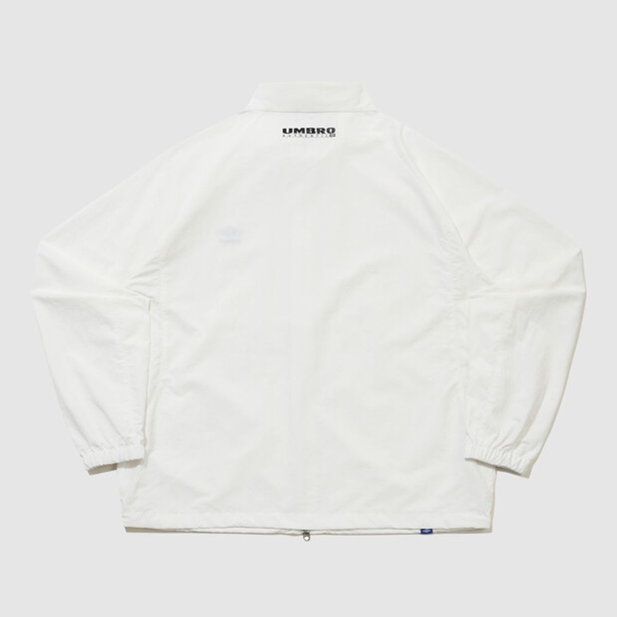 엄브로(UMBRO) 클래식 스탠넥 웜업 바람막이 자켓 아이보리 UR121CJK31