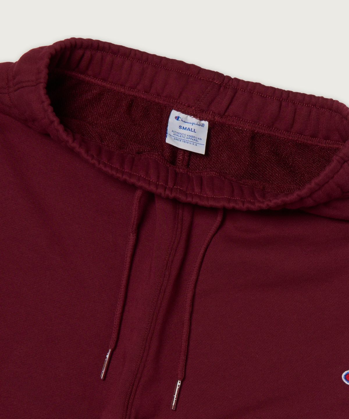 챔피온(CHAMPION) 여성 레귤러핏 부츠컷 스웨트 팬츠 Burgundy