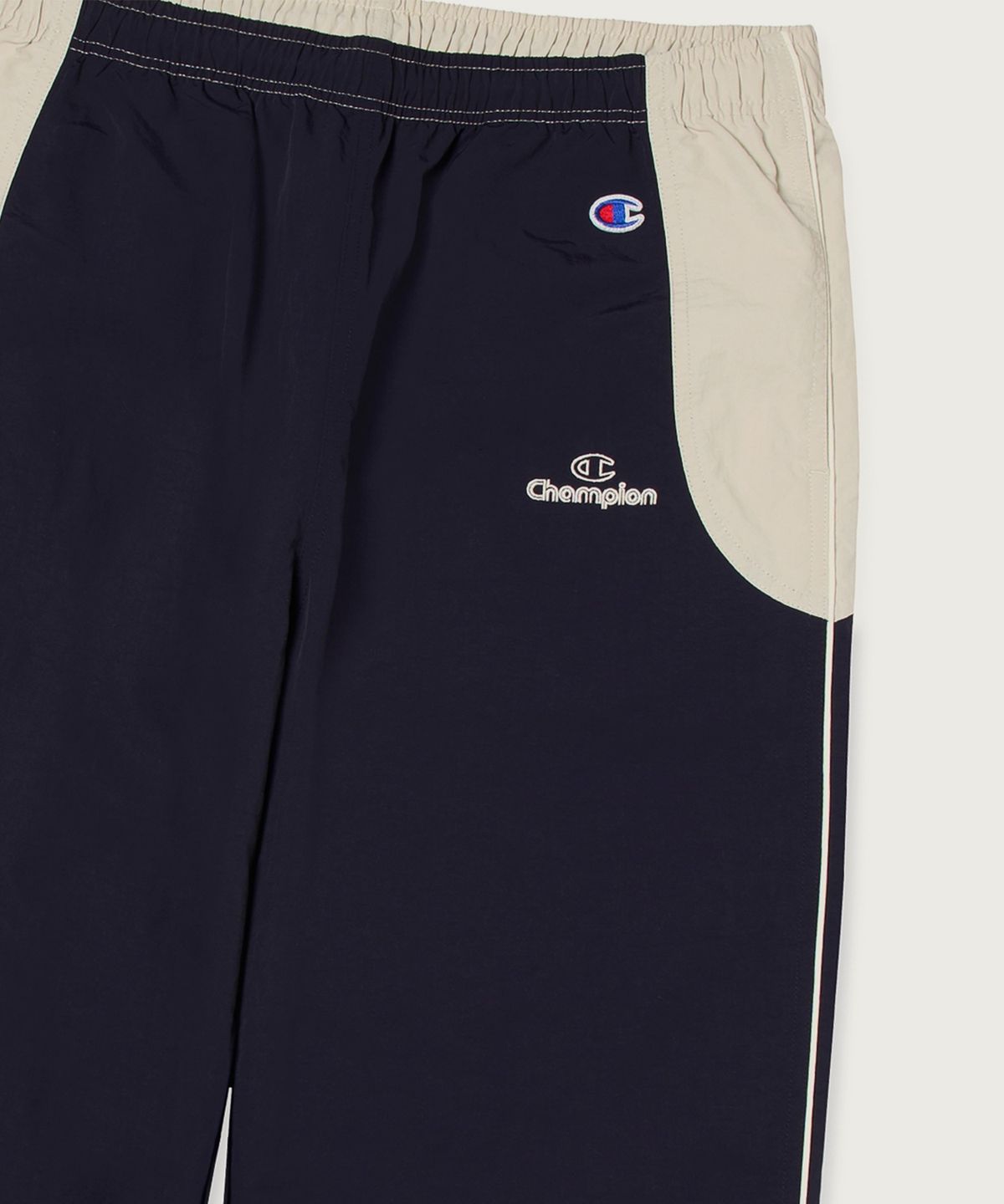 챔피온(CHAMPION) 트랙 로고 컬러블록 트랙 팬츠 Navy