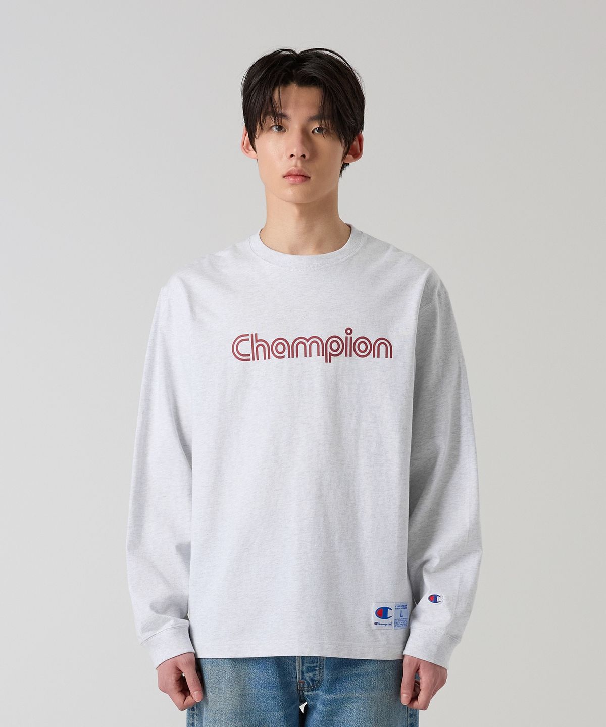 챔피온(CHAMPION) 트랙 로고 루즈핏 조그택 롱슬리브 티셔츠 Light Grey