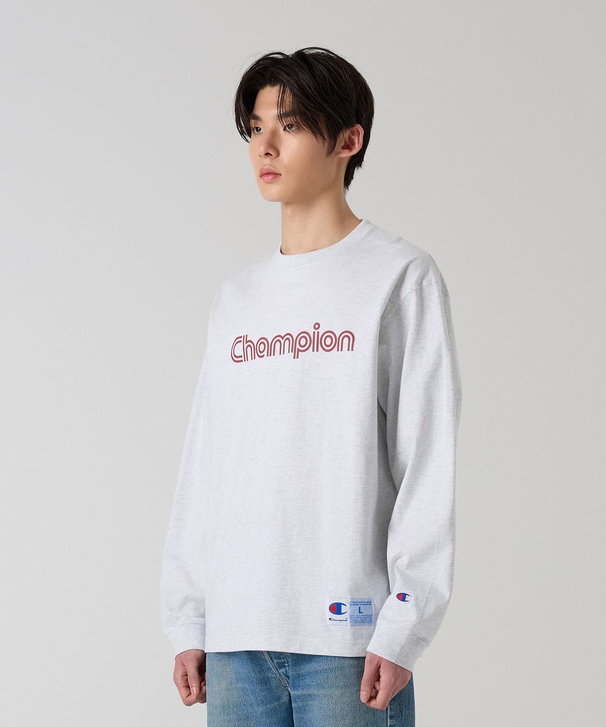 챔피온(CHAMPION) 트랙 로고 루즈핏 조그택 롱슬리브 티셔츠 Light Grey