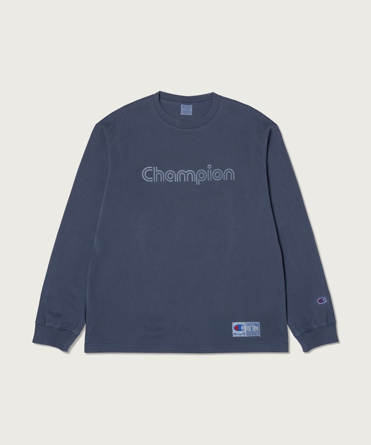 챔피온(CHAMPION) 트랙 로고 루즈핏 가먼트다잉 롱슬리브 티셔츠 Blue