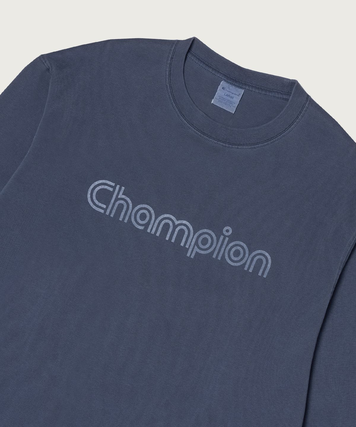 챔피온(CHAMPION) 트랙 로고 루즈핏 가먼트다잉 롱슬리브 티셔츠 Blue