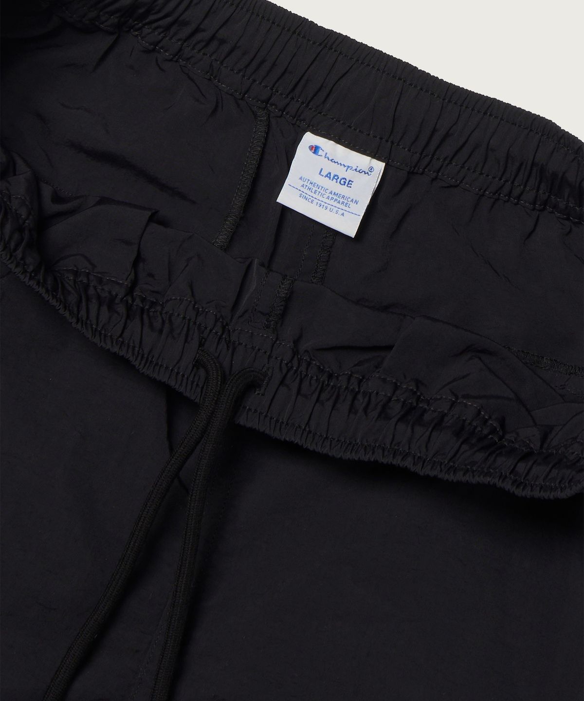 챔피온(CHAMPION) 트랙 로고 프로 쇼츠 Black
