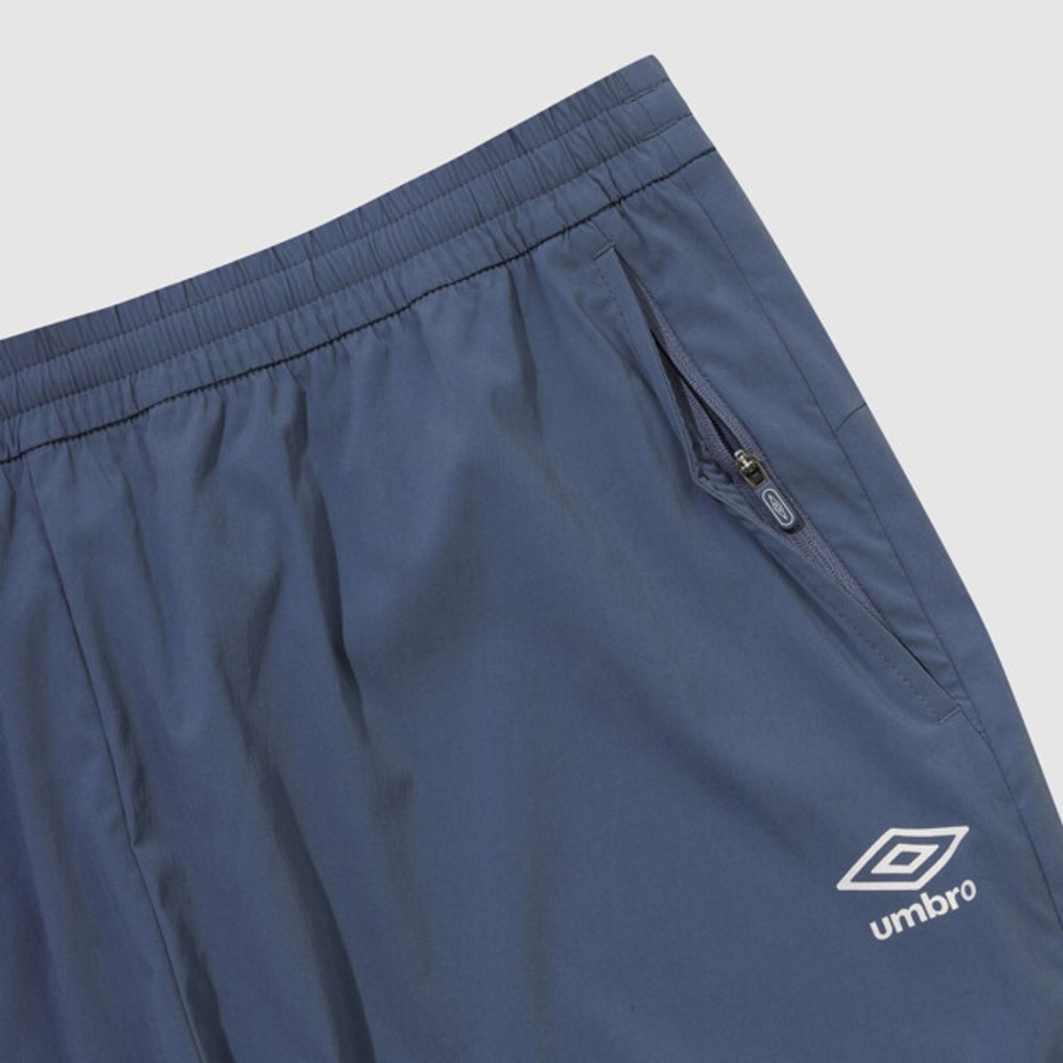 엄브로(UMBRO) PTR 우븐 워밍업 조거 팬츠 블루 UR121SPT39