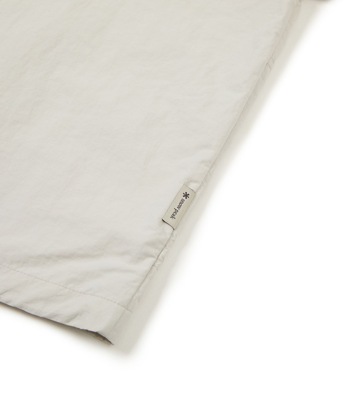 스노우피크 어패럴(SNOWPEAK APPAREL) S23MWLWB52 타슬란 우먼스 세미크롭 바람막이 Light Beige