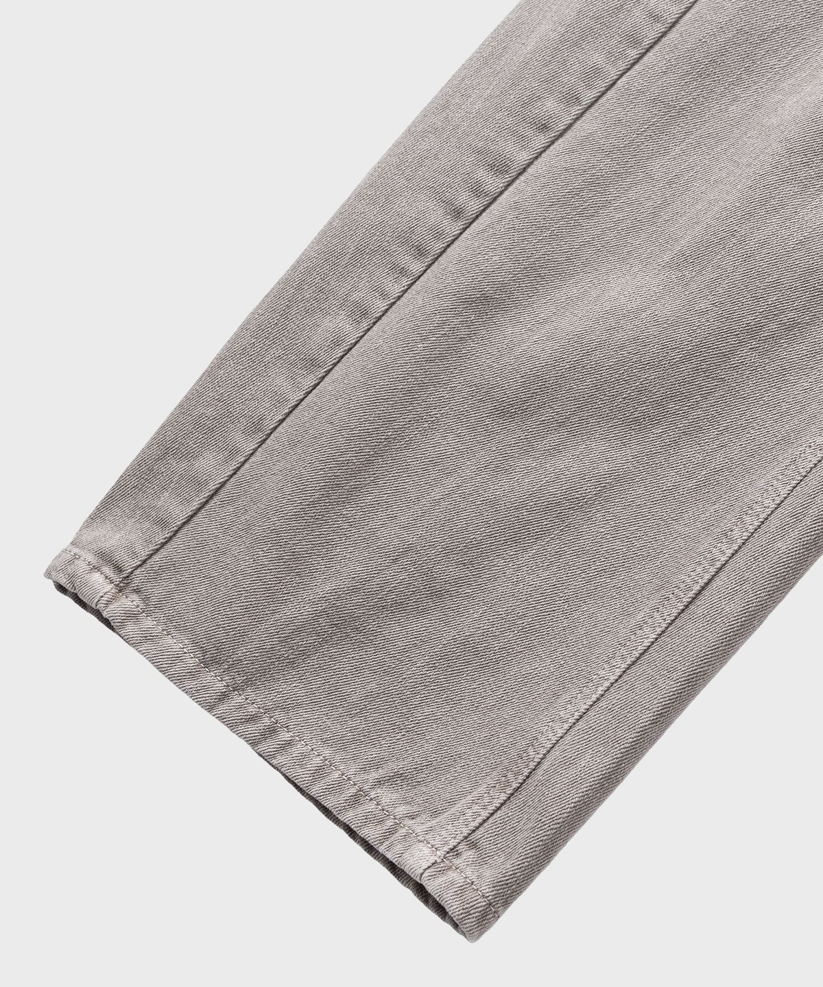 넌블랭크(NONBLANK) 가먼트 다잉 커브드 데님 팬츠_BEIGE