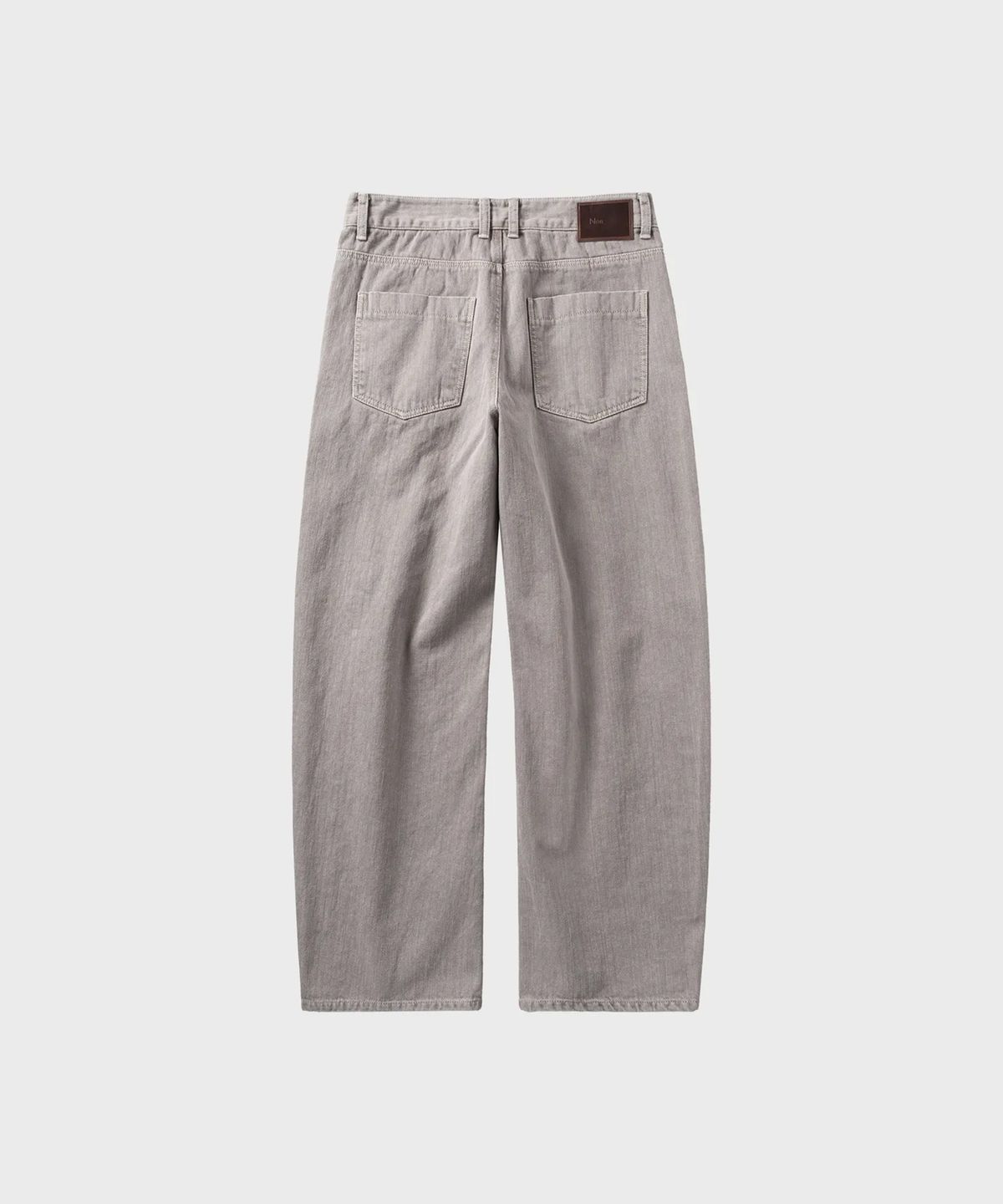 넌블랭크(NONBLANK) 가먼트 다잉 커브드 데님 팬츠_BEIGE