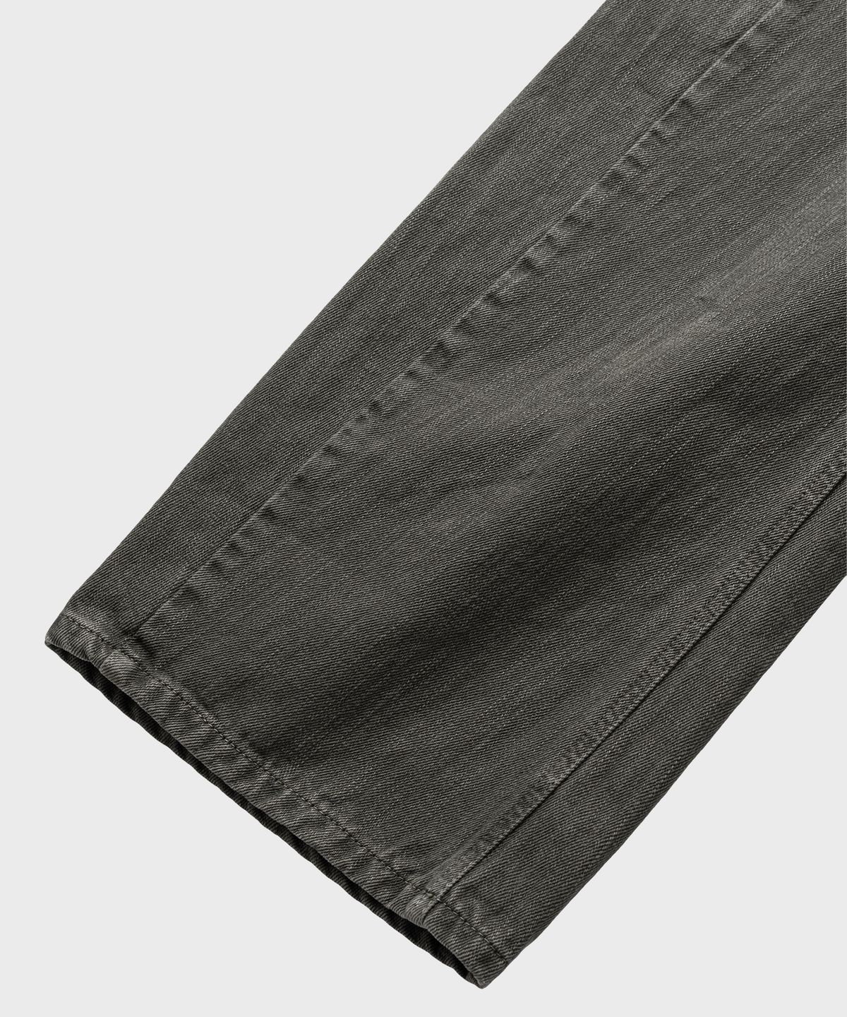 넌블랭크(NONBLANK) 가먼트 다잉 커브드 데님 팬츠_KHAKI