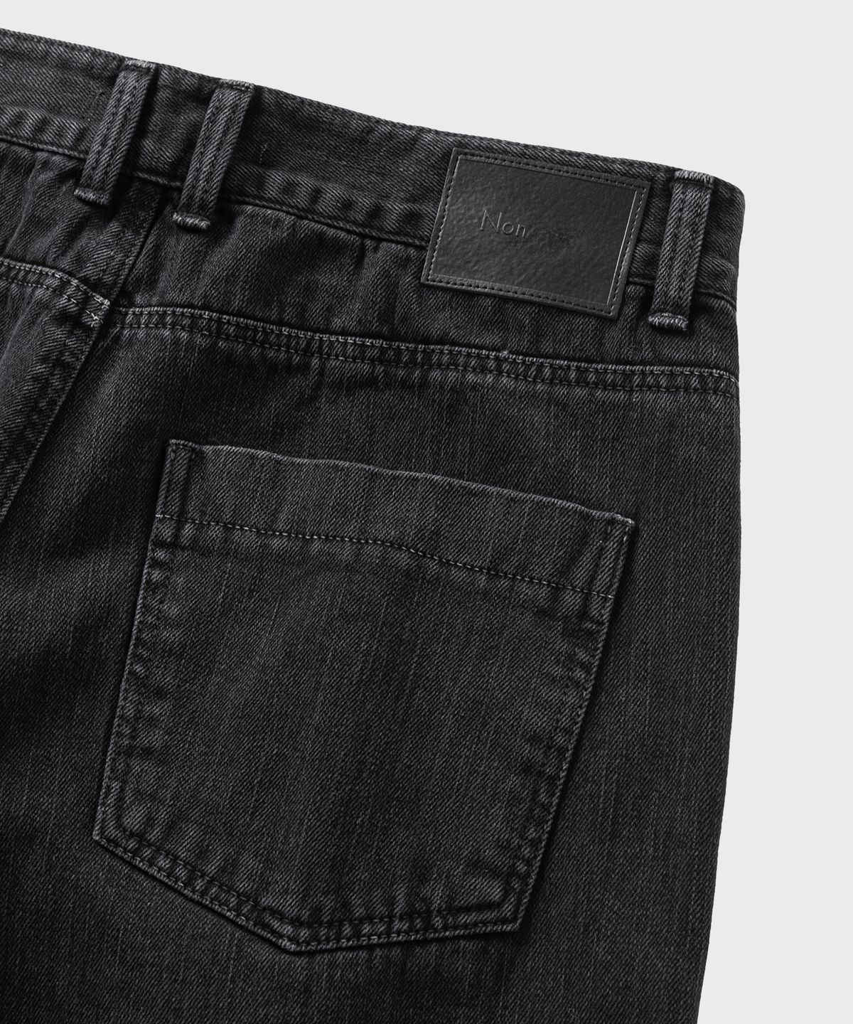 넌블랭크(NONBLANK) 가먼트 다잉 커브드 데님 팬츠_DARK GREY
