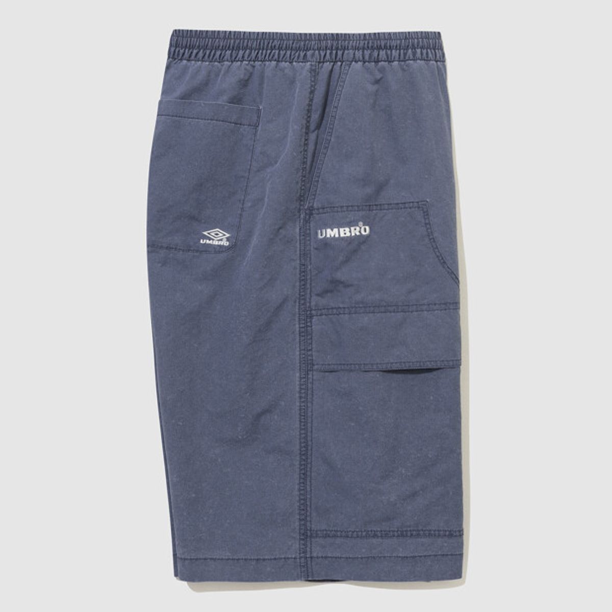 엄브로(UMBRO) HBL 엄그레이 워싱 6부 버뮤다 우븐 반바지 블루 UR121CHP21