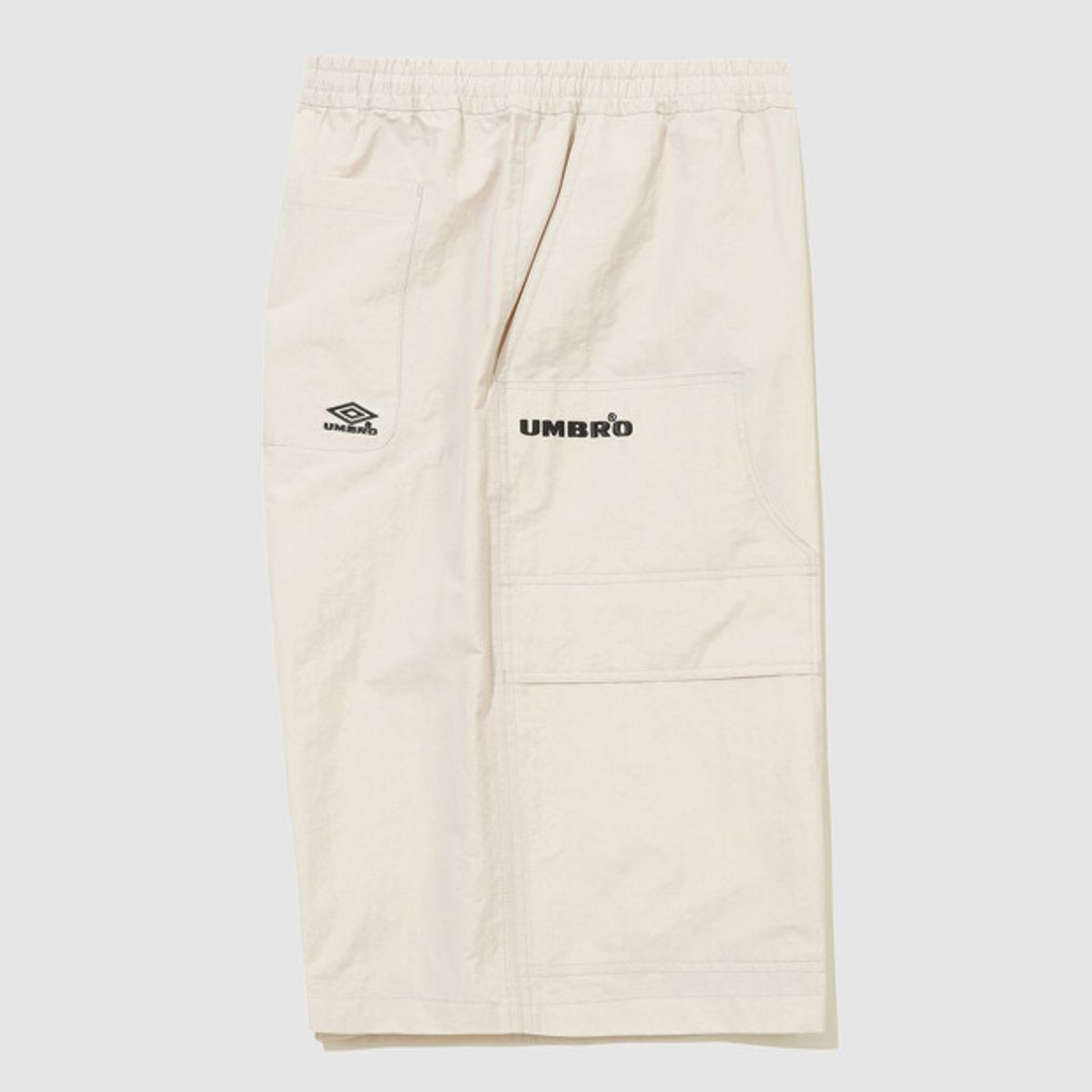 엄브로(UMBRO) HBL 엄그레이 워싱 6부 버뮤다 우븐 반바지 아이보리 UR121CHP21