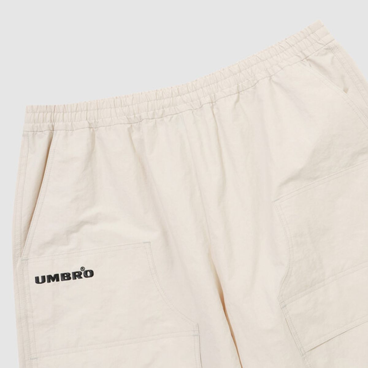 엄브로(UMBRO) HBL 엄그레이 워싱 6부 버뮤다 우븐 반바지 아이보리 UR121CHP21