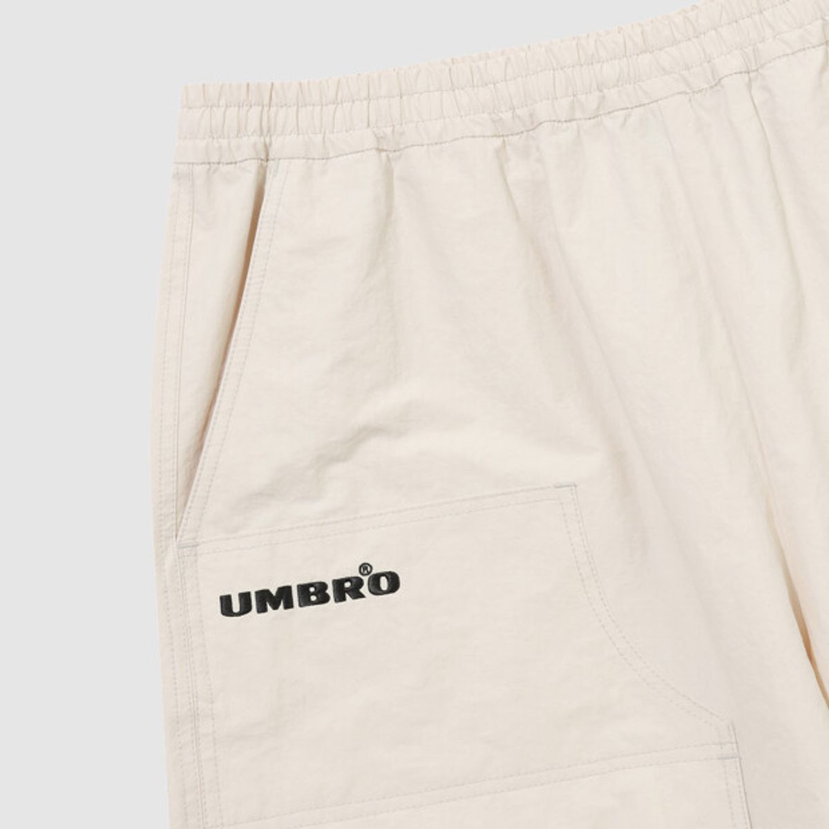 엄브로(UMBRO) HBL 엄그레이 워싱 6부 버뮤다 우븐 반바지 아이보리 UR121CHP21