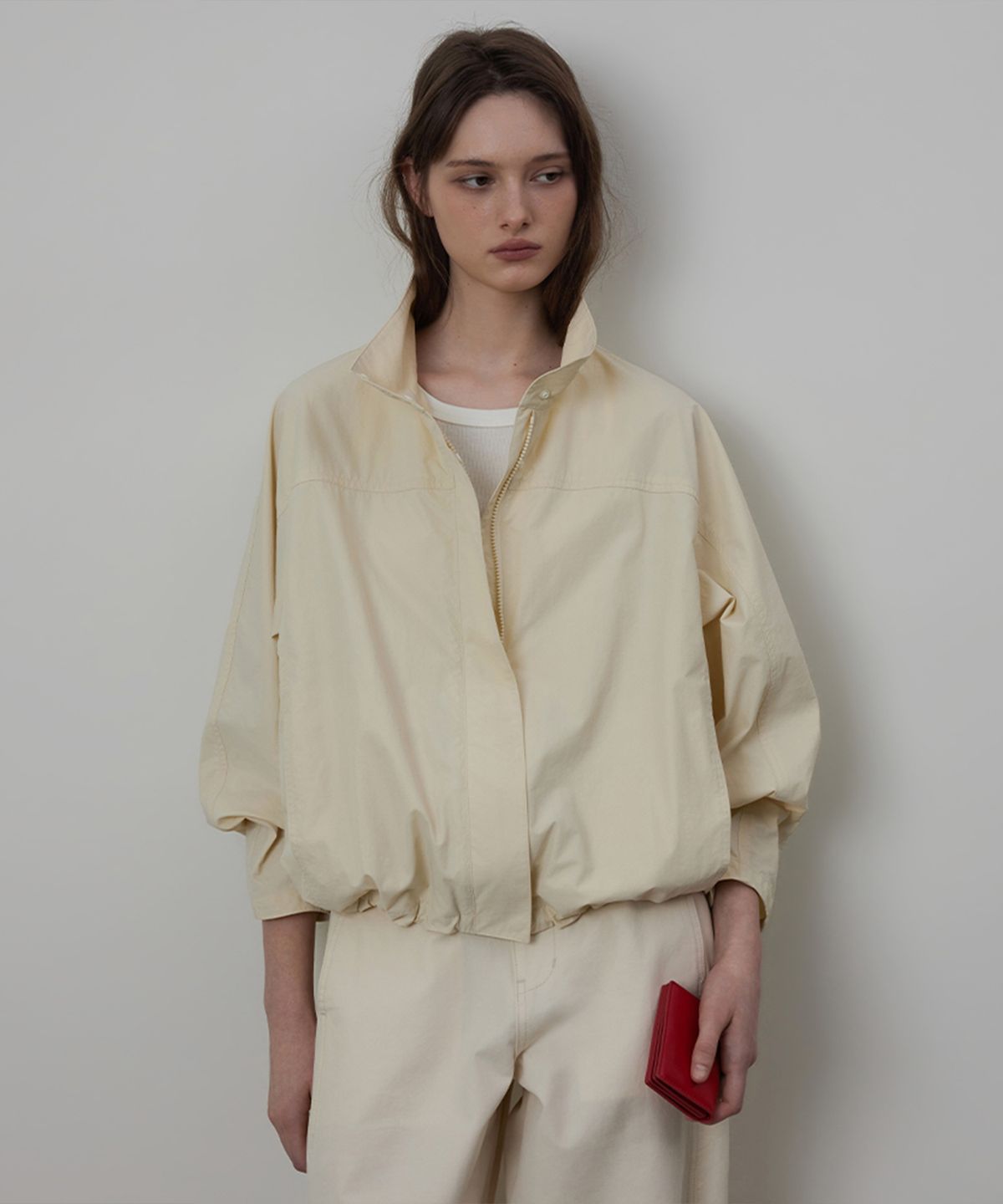 퀸스래빗(Q'SRB) High-Neck Raglan Drawstring Wind Jumper